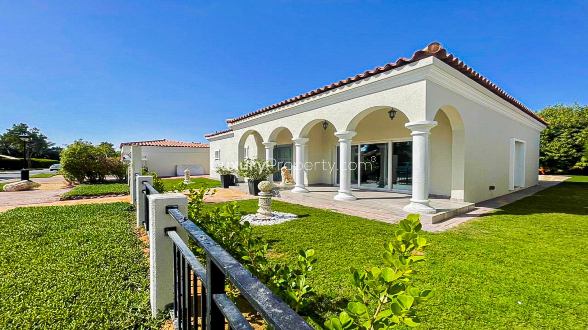 N/A,Fully upgraded villa exterior with arches and lawn in Green Community West
