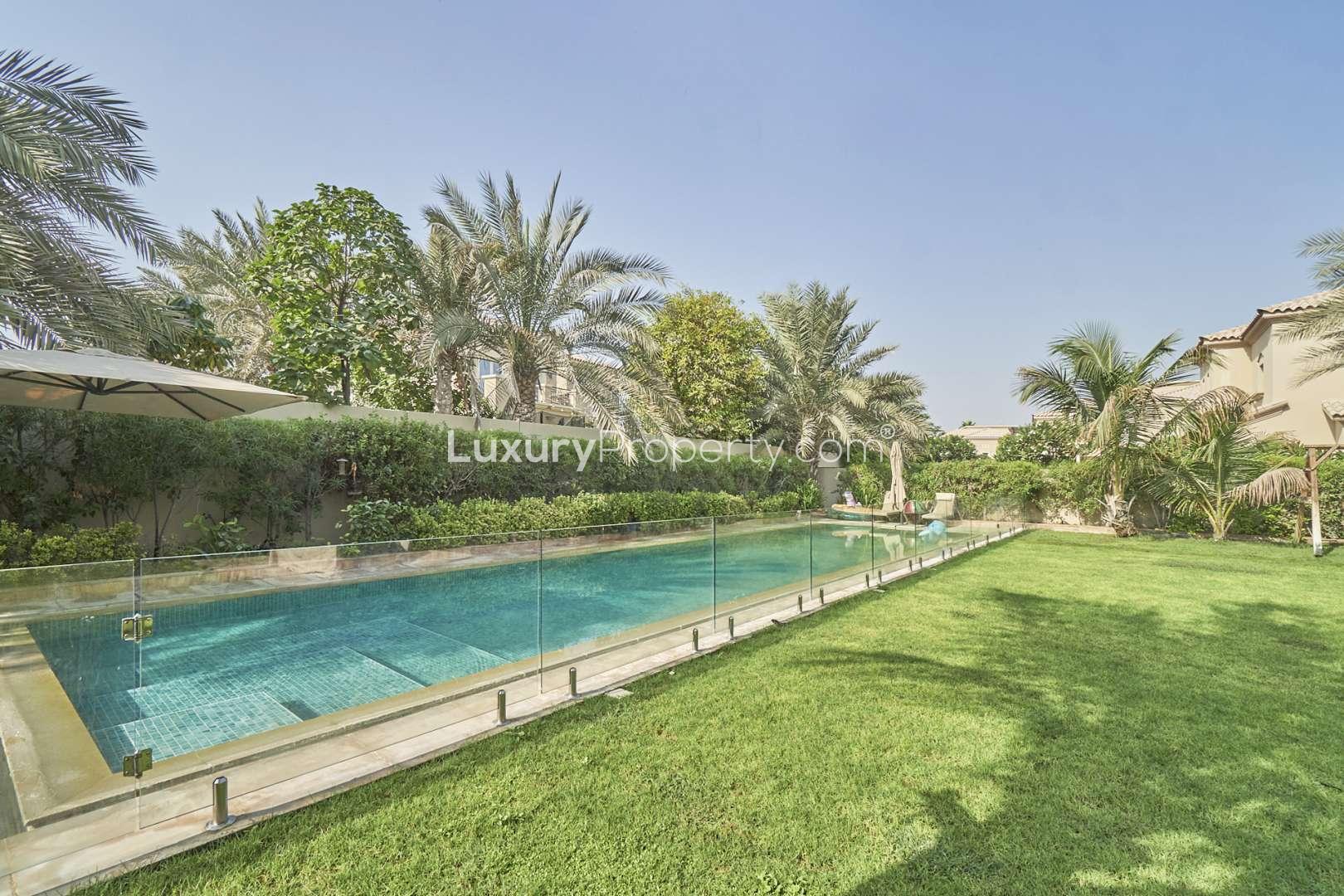 Bright dining area in 4-bedroom Alvorada villa, Arabian Ranches, featuring garden views