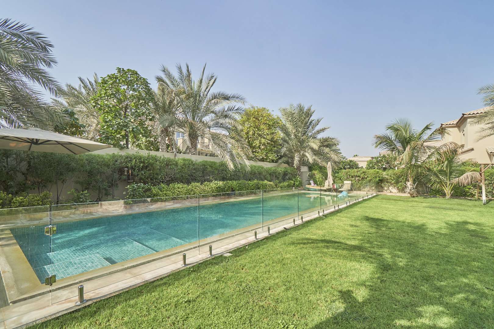 Bright dining area in 4-bedroom Alvorada villa, Arabian Ranches, featuring garden views