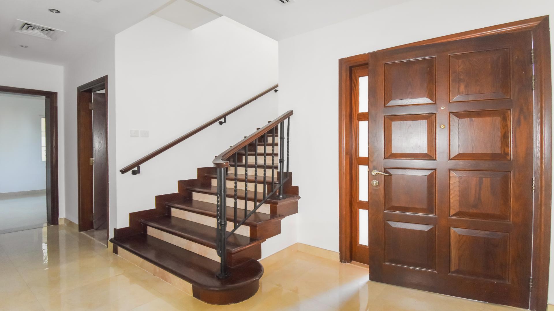 "Elegant staircase and wooden door in Alvorada 4-bedroom villa, Arabian Ranches for sale.",Bright living area in upgraded 4-bedroom villa, Alvorada, Arabian Ranches, for sale