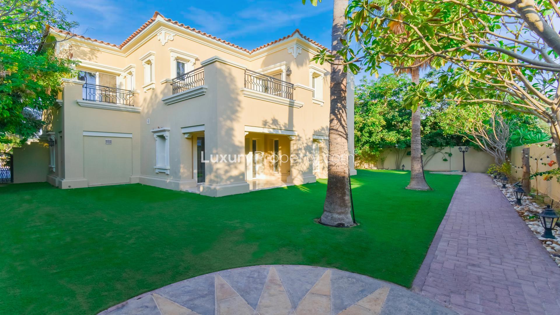 Upgraded 4-bedroom villa exterior with lush garden in Alvorada, Arabian Ranches