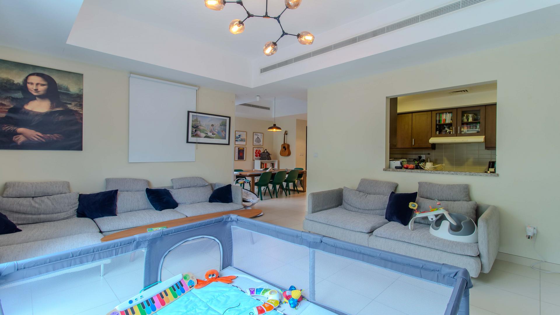 Four-bedroom villa exterior in Mira Community, Reem; modern architecture with greenery