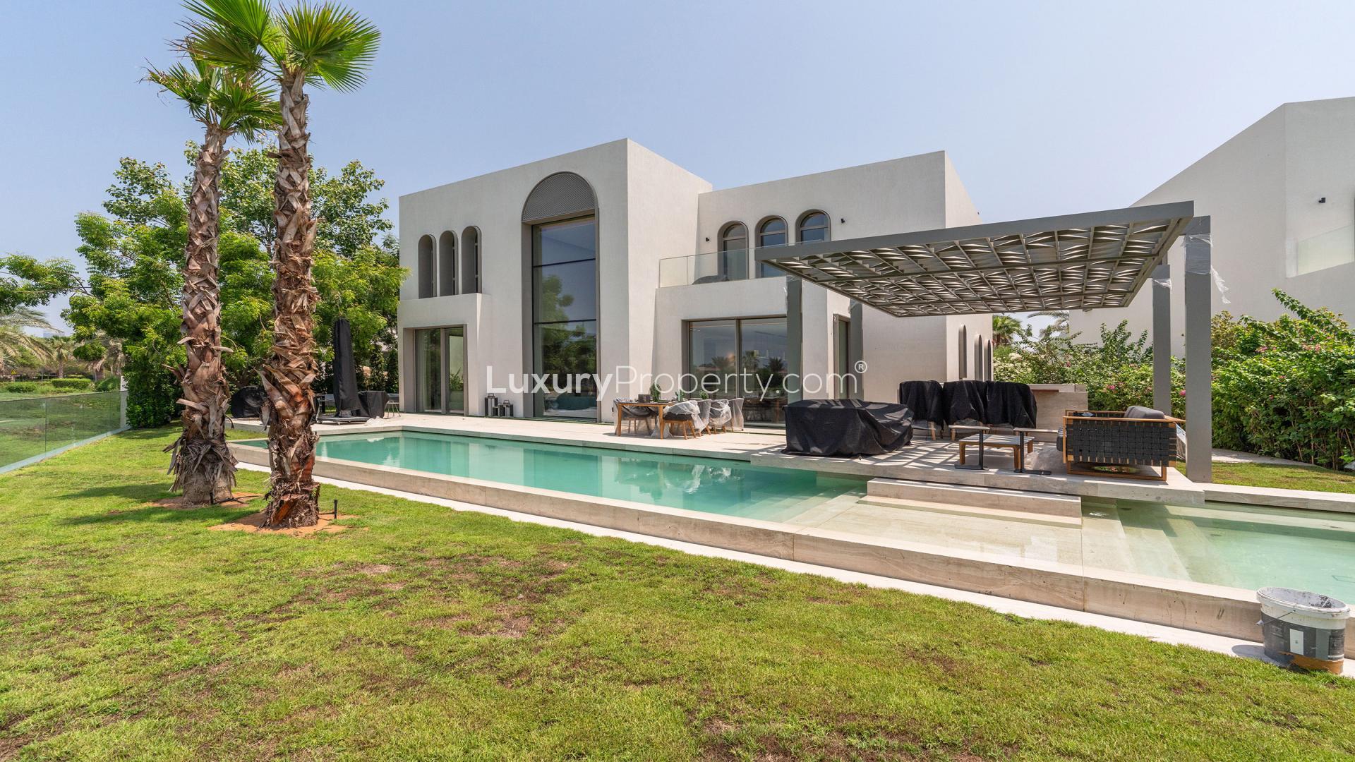Modern villa interior with open-plan living area and sleek kitchen in Jumeirah Islands