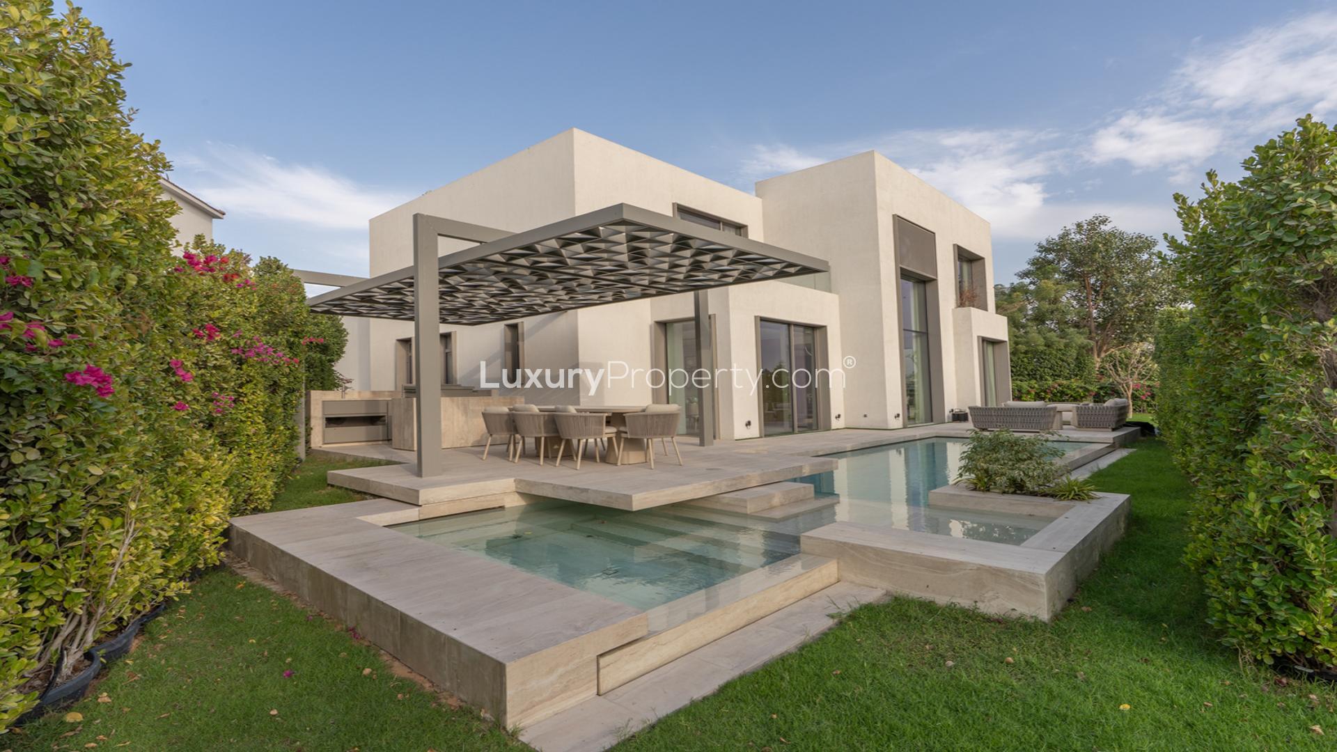 Lake view from garden of upgraded villa in Jumeirah Islands, Islamic Clusters