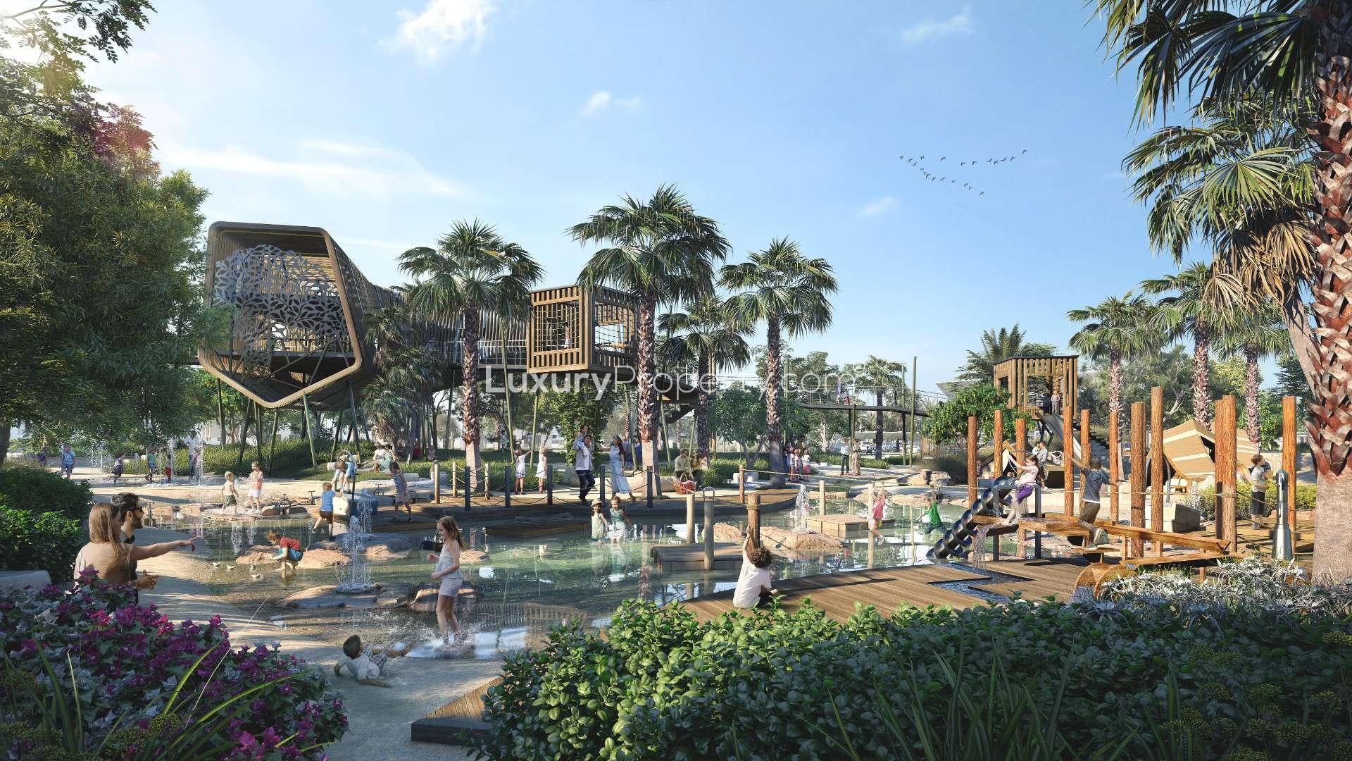 Modern bathroom in Tilal Al Ghaf villa with dual sinks and glass shower enclosure