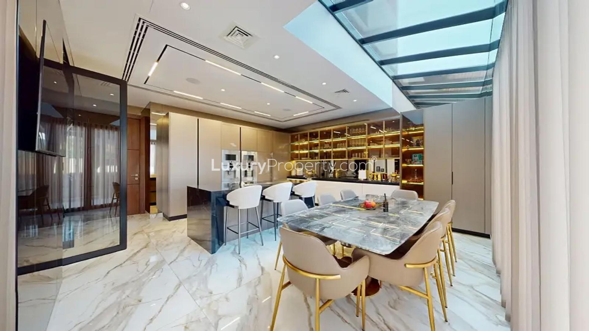 Modern kitchen and dining area in Al Barari villa for sale, The Nest community