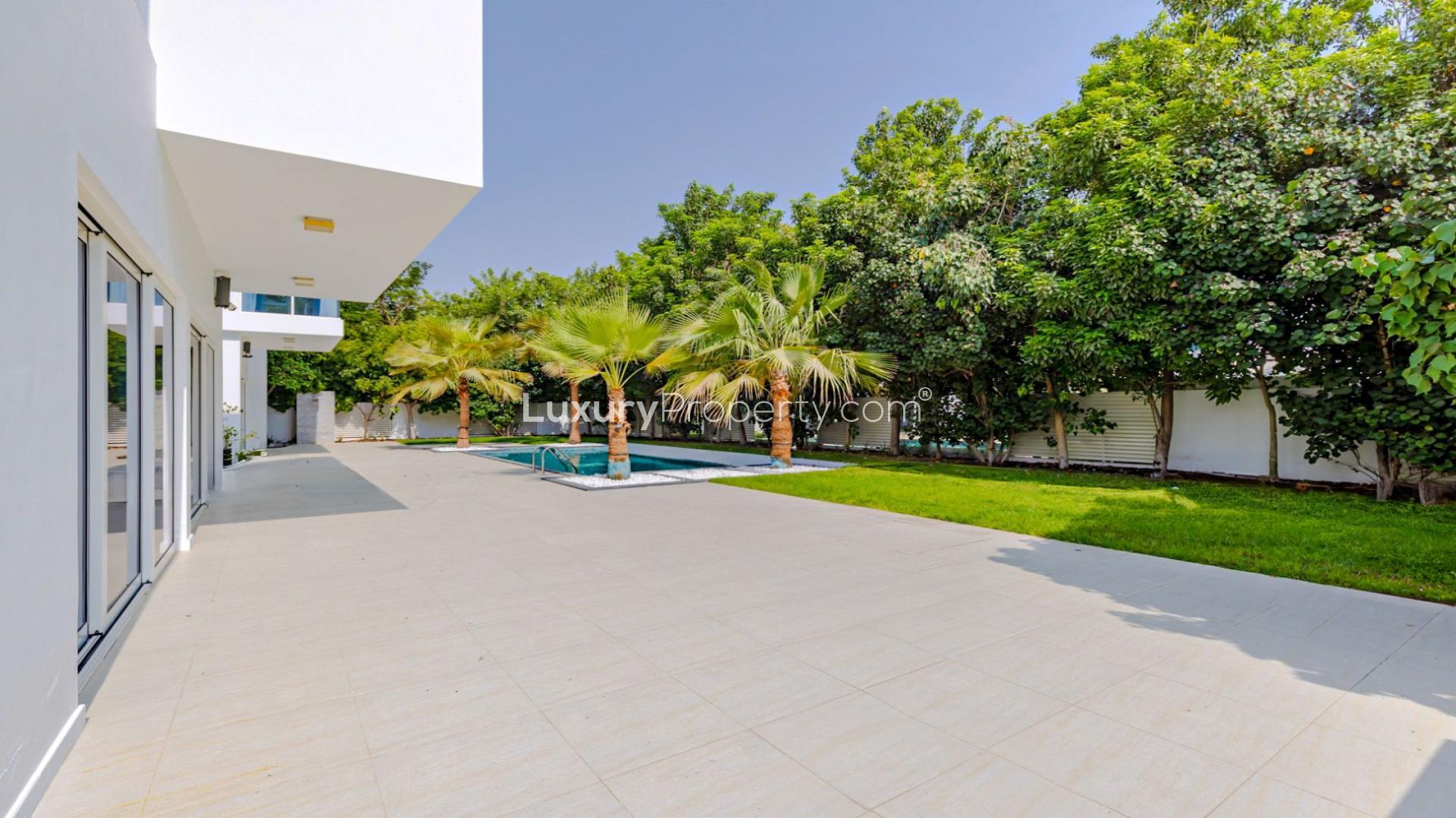Luxury villa courtyard at The Nest, Al Barari, featuring modern design and large windows