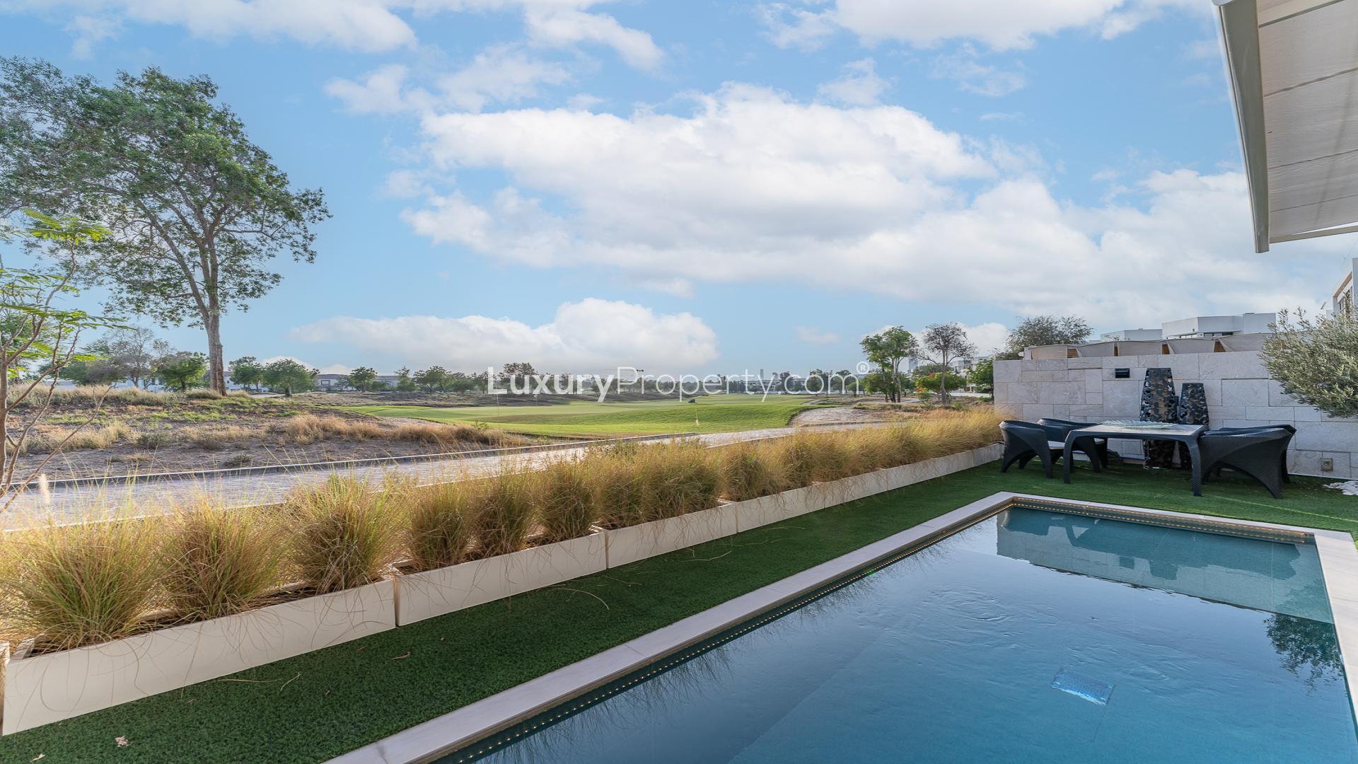 Luxurious villa interior with modern decor, overlooking golf course in Jumeirah Golf Estates