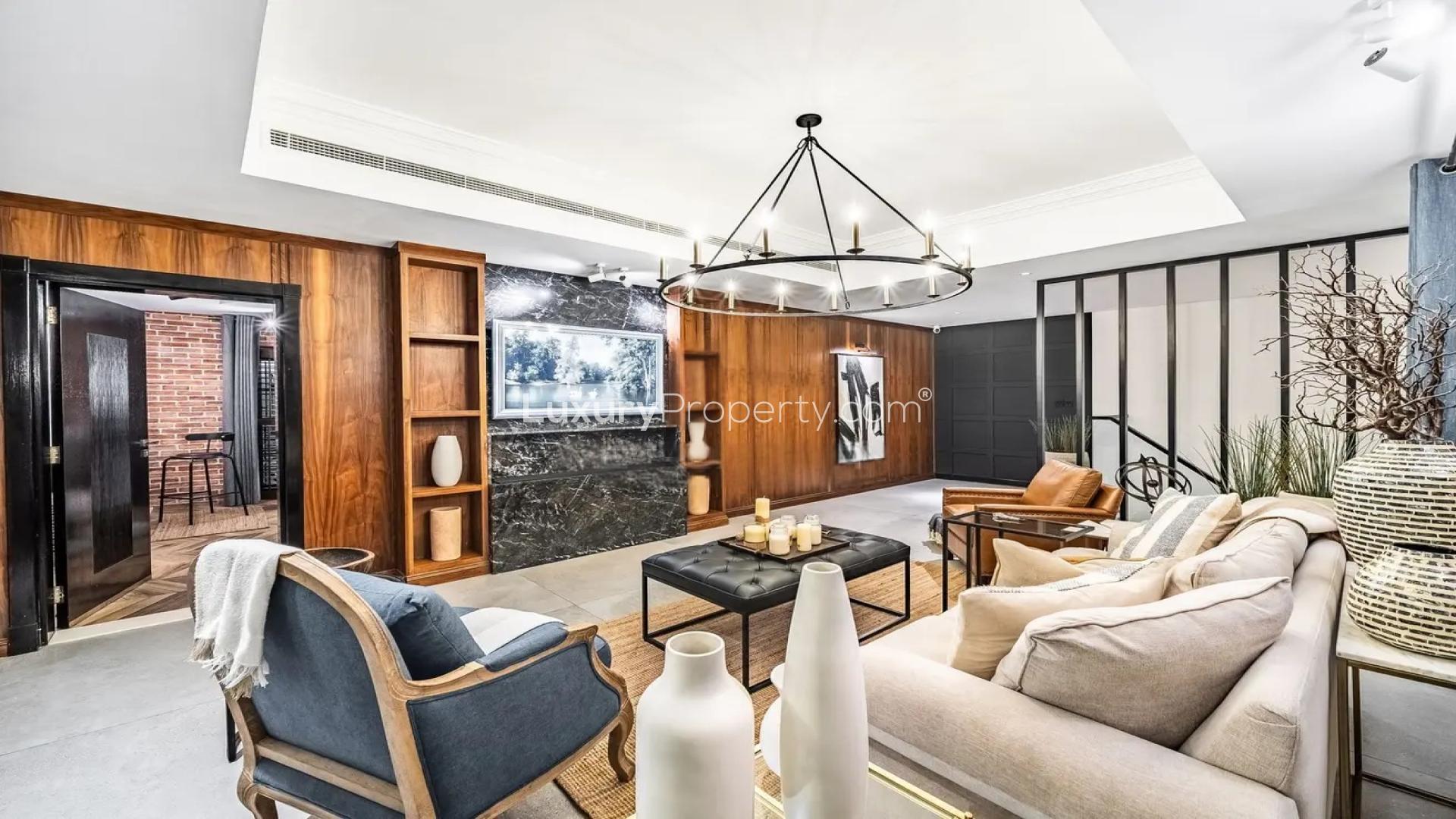 Elegant living room in Al Furjan villa, featuring modern decor and cozy seating area