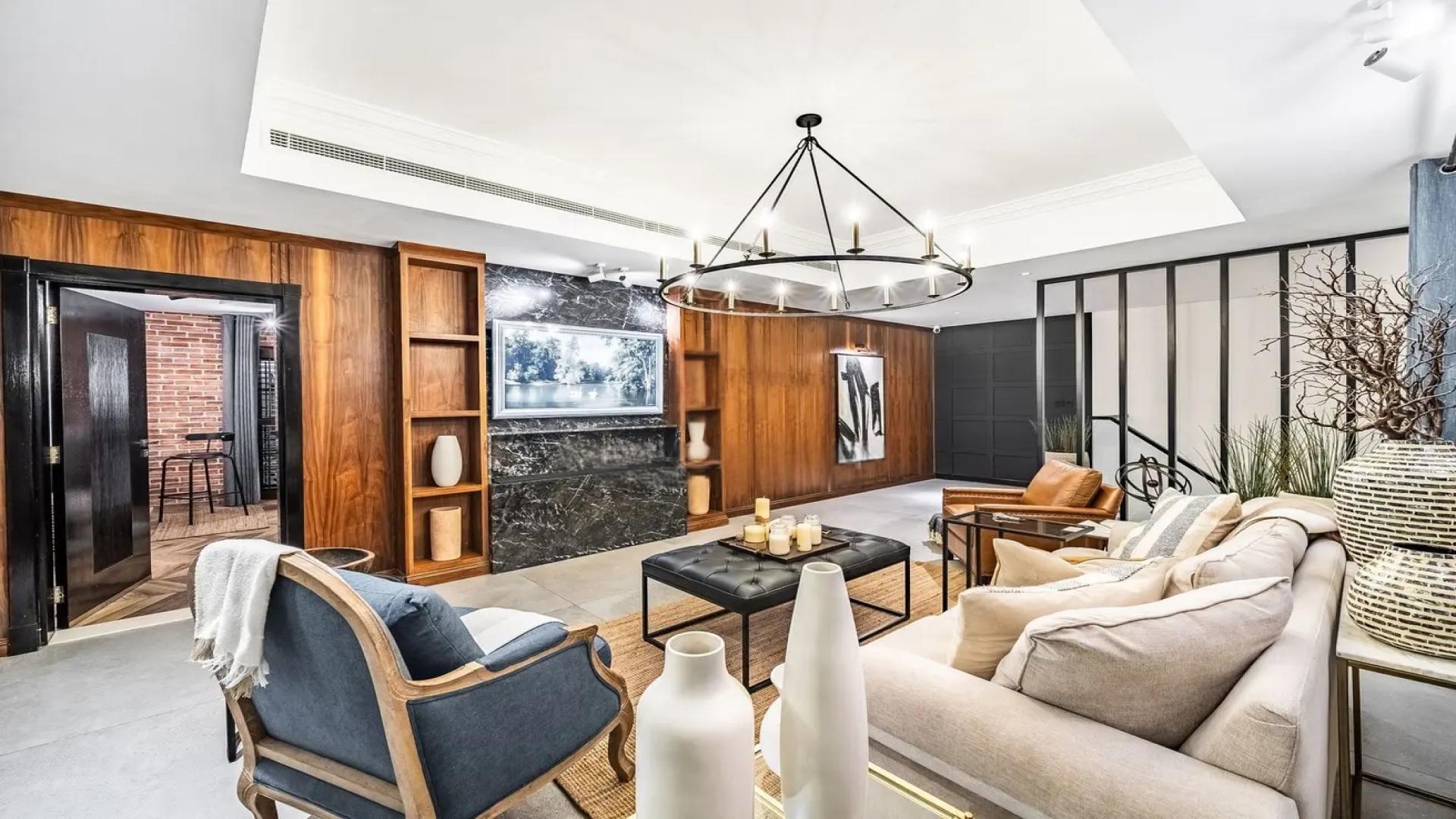 Elegant living room in Al Furjan villa, featuring modern decor and cozy seating area