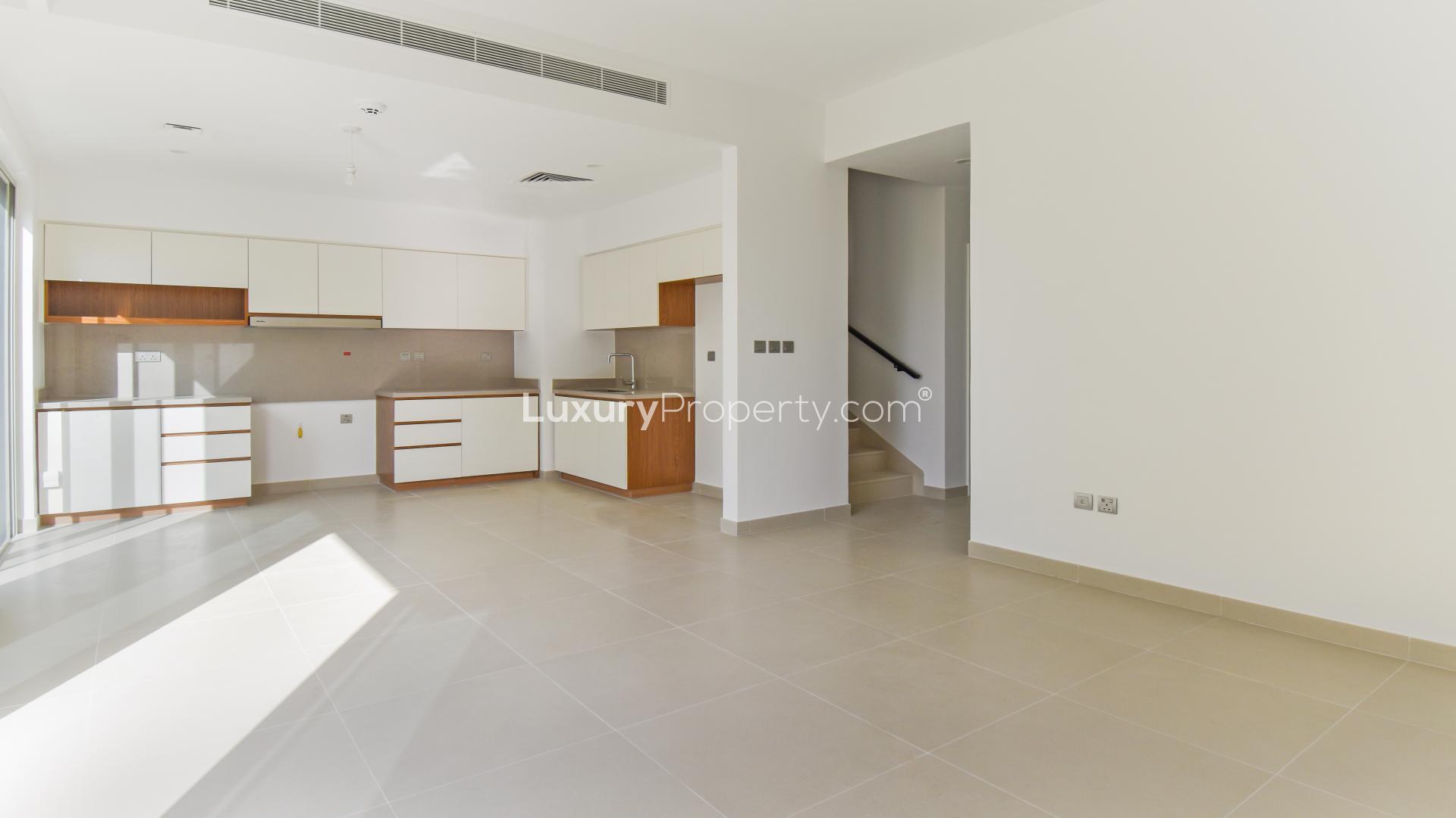 Bright open-plan kitchen and living area in Camelia villa, Arabian Ranches 2