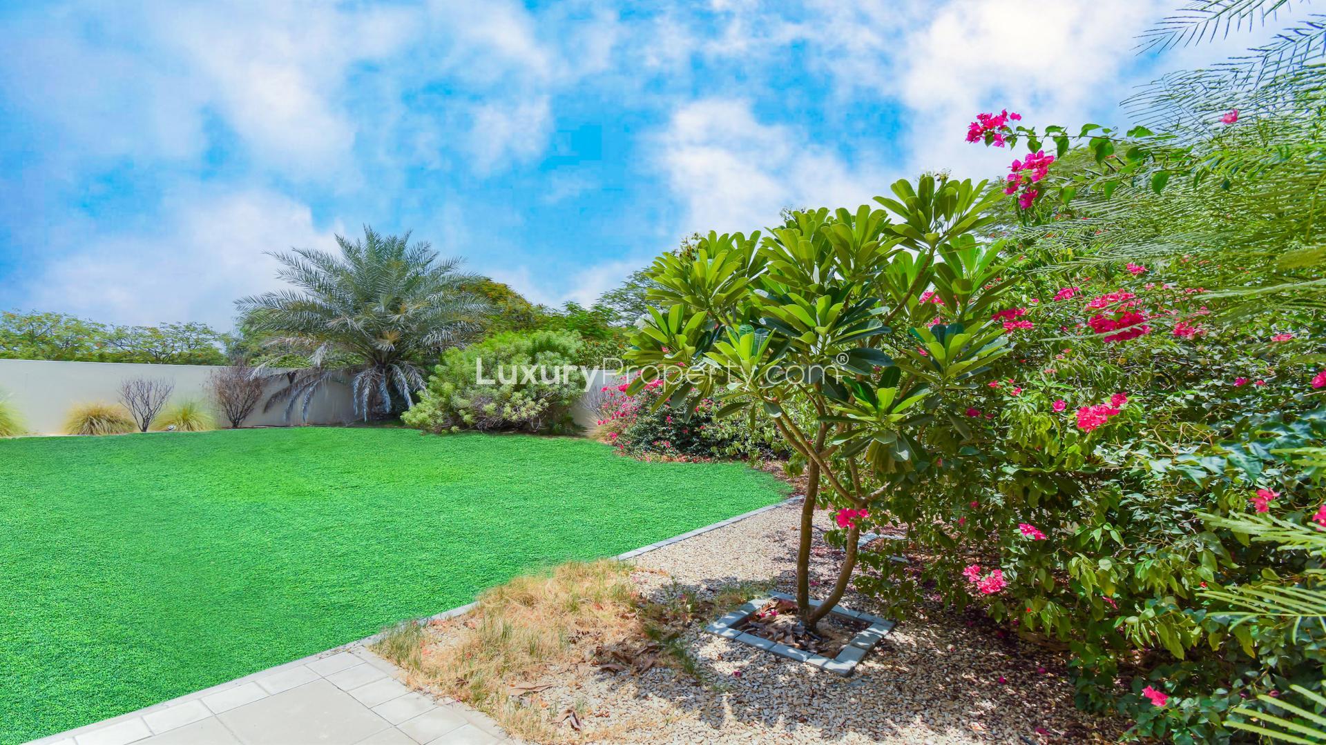 Lush green garden of 4-bedroom villa in Casa, Arabian Ranches 2 for sale