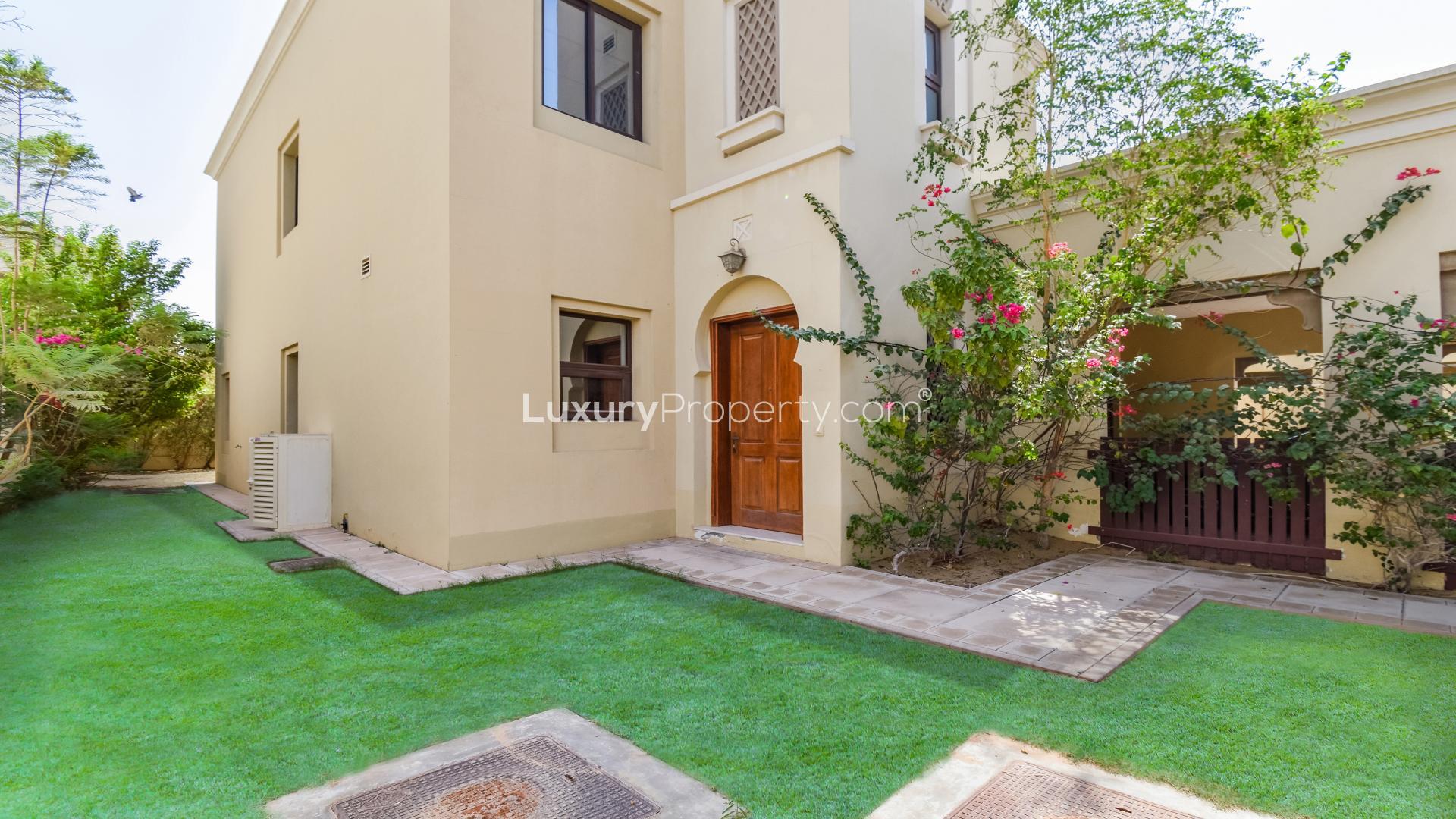 "Charming villa entrance with lush garden in Casa, Arabian Ranches 2, for sale.",Spacious living room with staircase in 4-bedroom villa, Arabian Ranches 2, Casa community