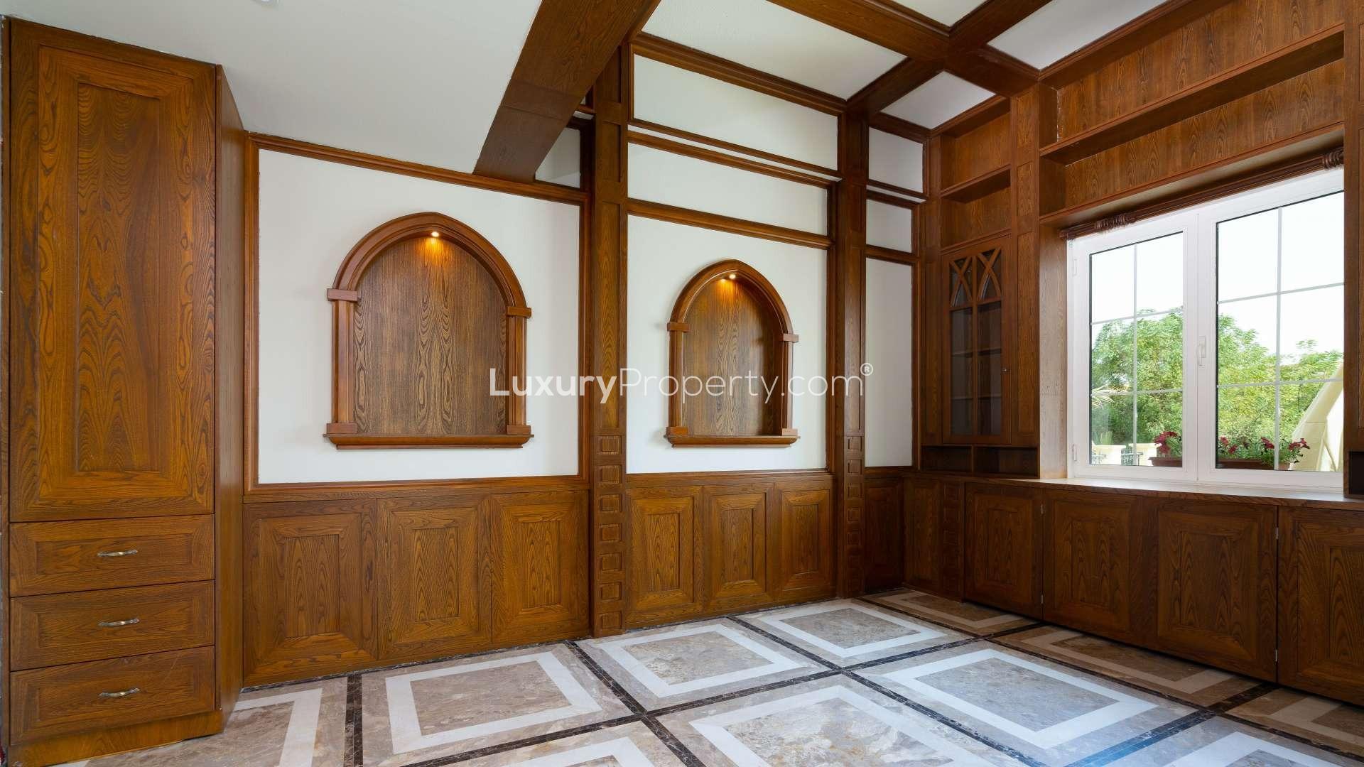 Luxury upgraded 4-bedroom villa exterior with landscaped garden in Jumeirah Islands, Cluster 16