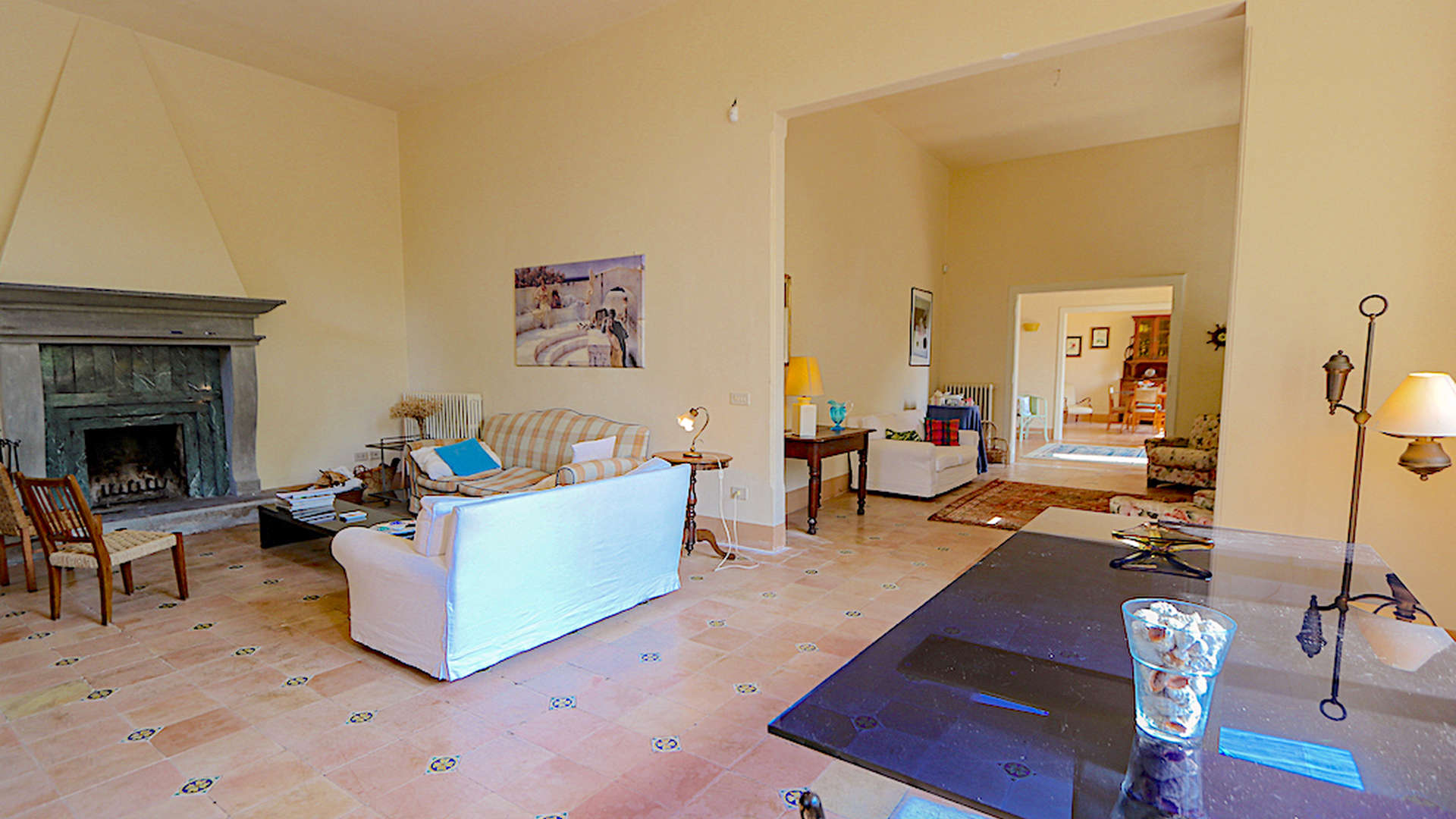 Living room of 4-bedroom coastal villa in Quercianella, Italy with fireplace and elegant decor