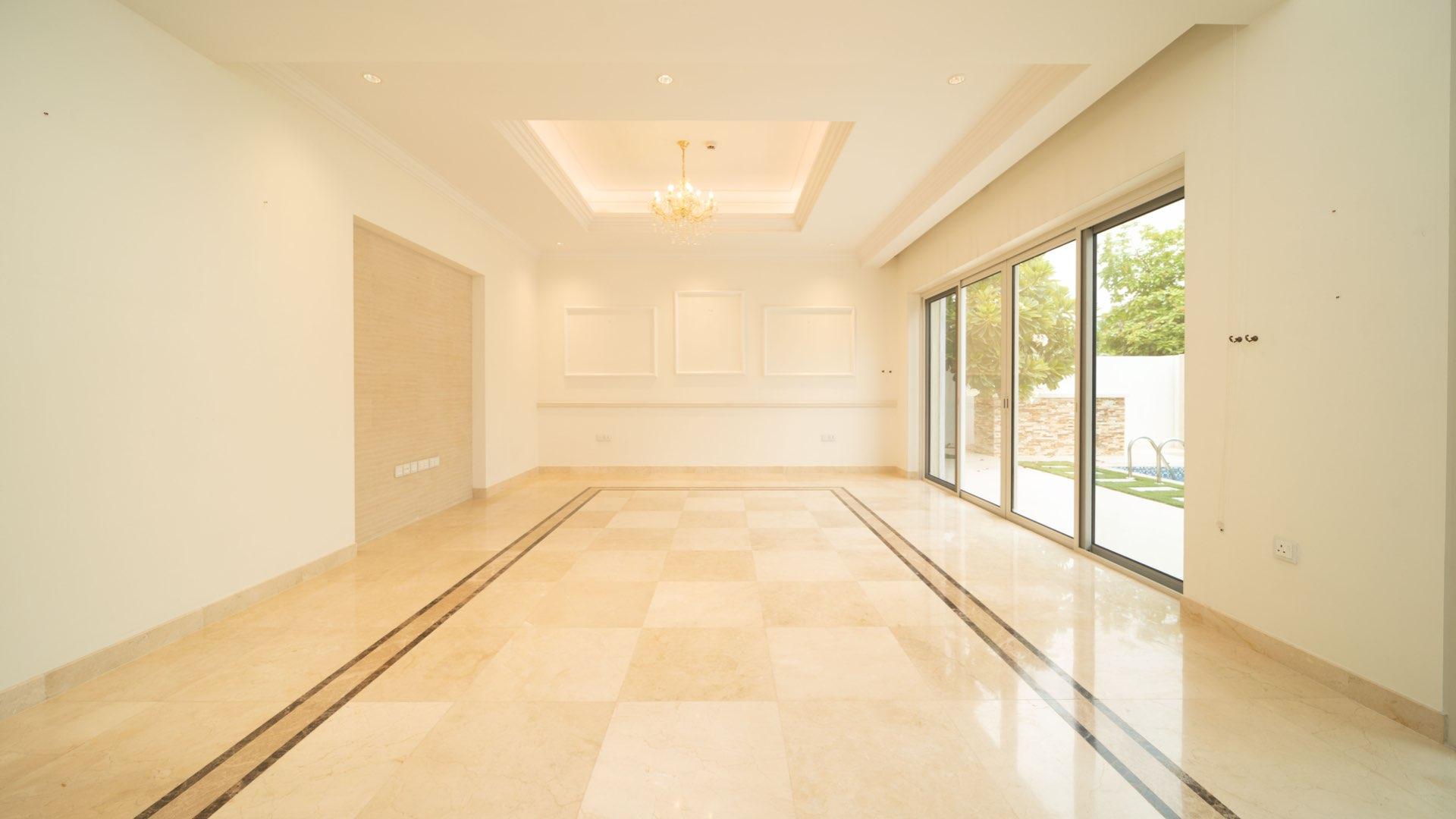 Luxurious Mediterranean villa interior with marble floors, large windows, in District One, MBR City