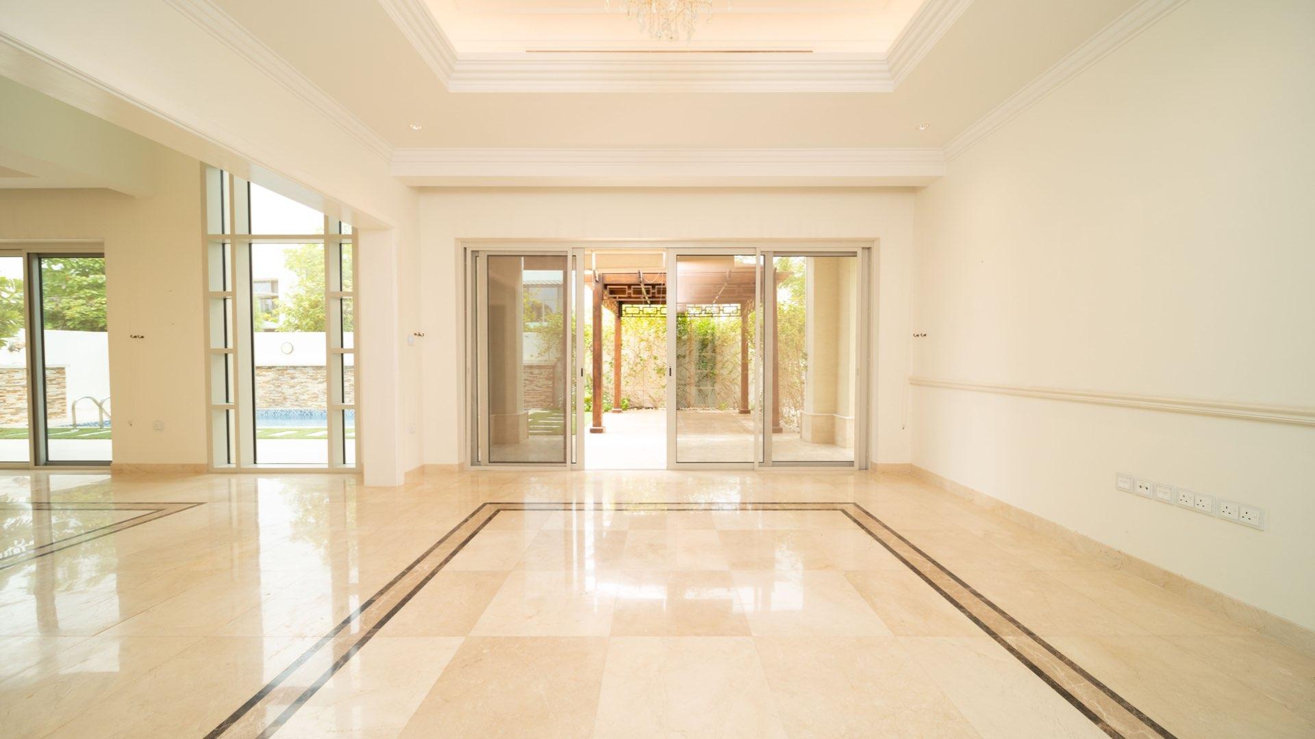Luxurious Mediterranean villa interior with marble floors and large windows in District One