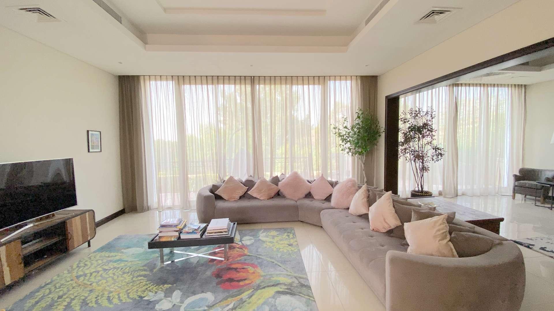 Balcony view of lush greenery in Jumeirah Golf Estates, Earth community villa for sale