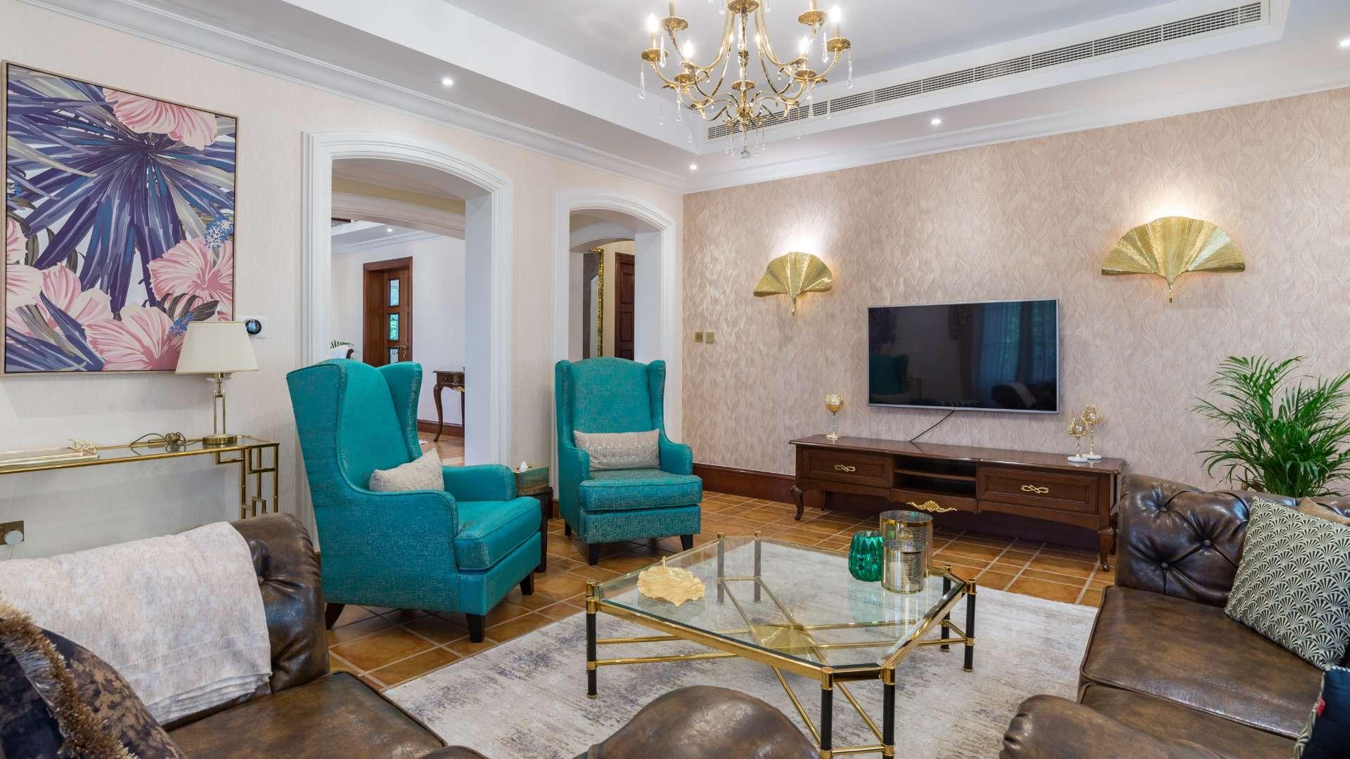 "Upgraded four-bedroom villa exterior in Jumeirah Golf Estates, Earth community, for sale.",Elegant living room in upgraded four-bedroom villa, Jumeirah Golf Estates, Earth community
