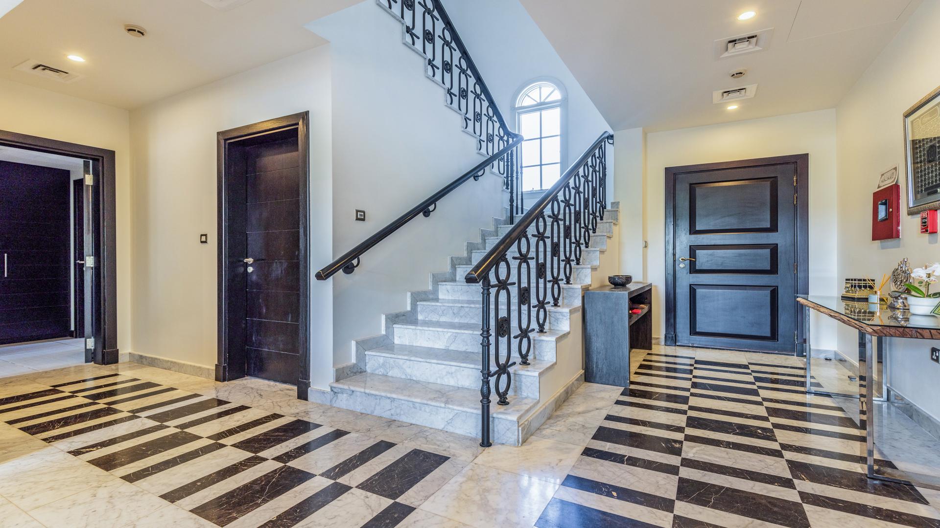 Villa with pool overlooking lush golf course in Jumeirah Golf Estates, Earth community