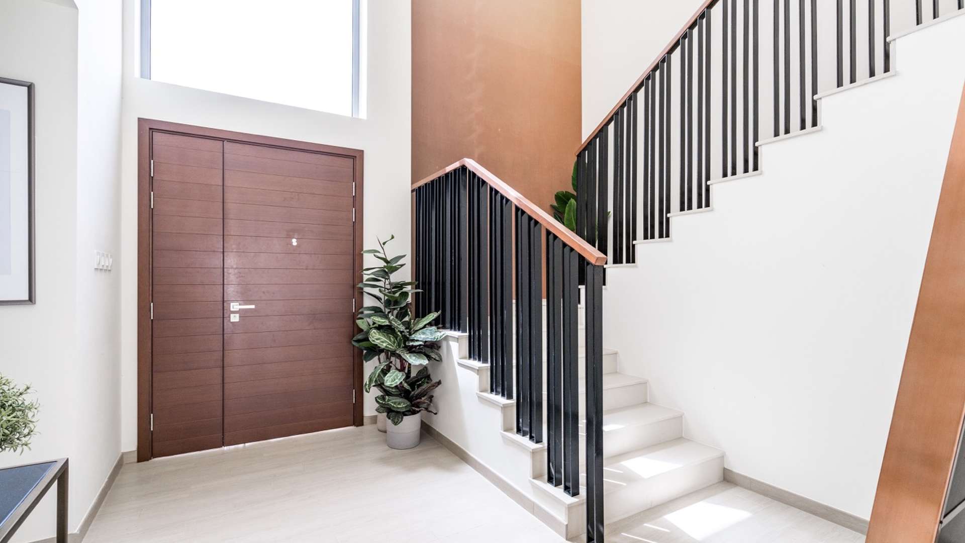 Beautiful four-bedroom villa exterior in Emaar South with modern design and landscaped surroundings