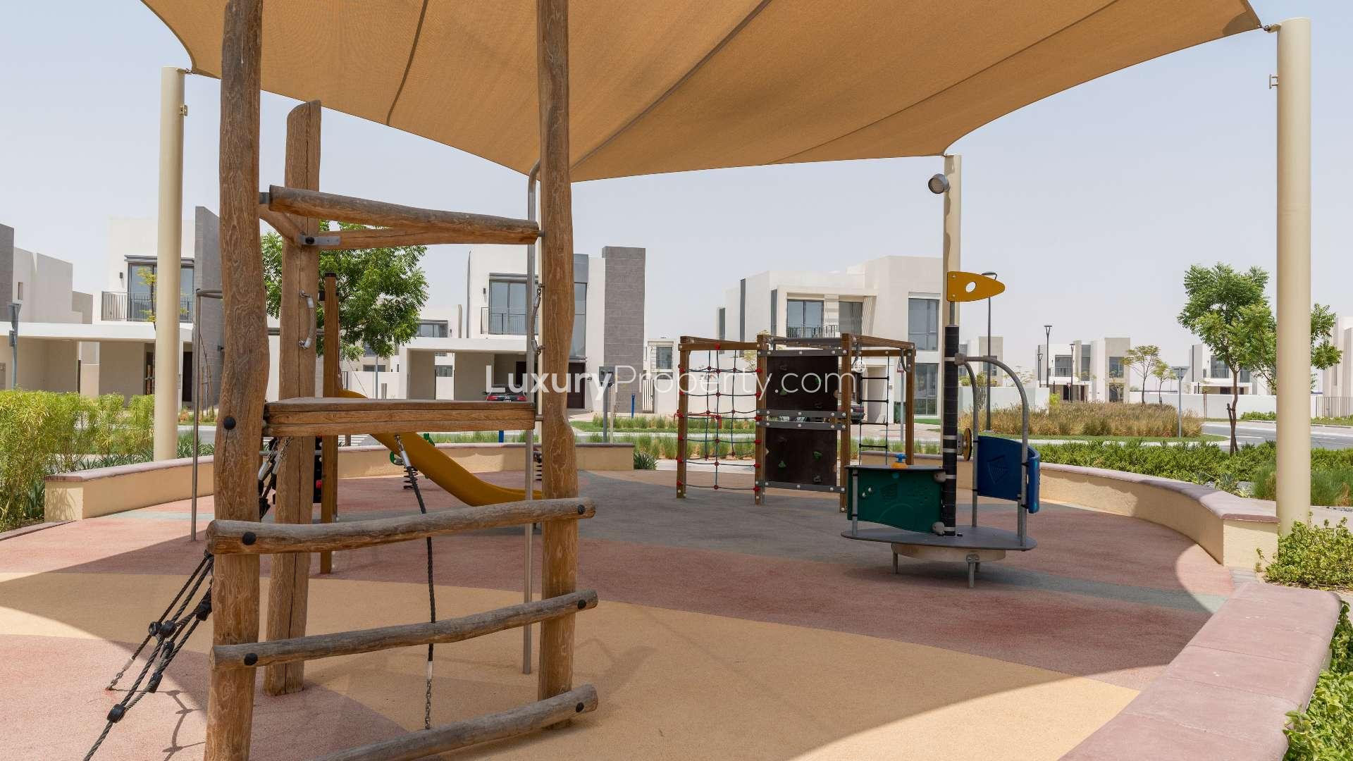 Outdoor pool area with sun loungers at Emaar South Golf Links villa for sale