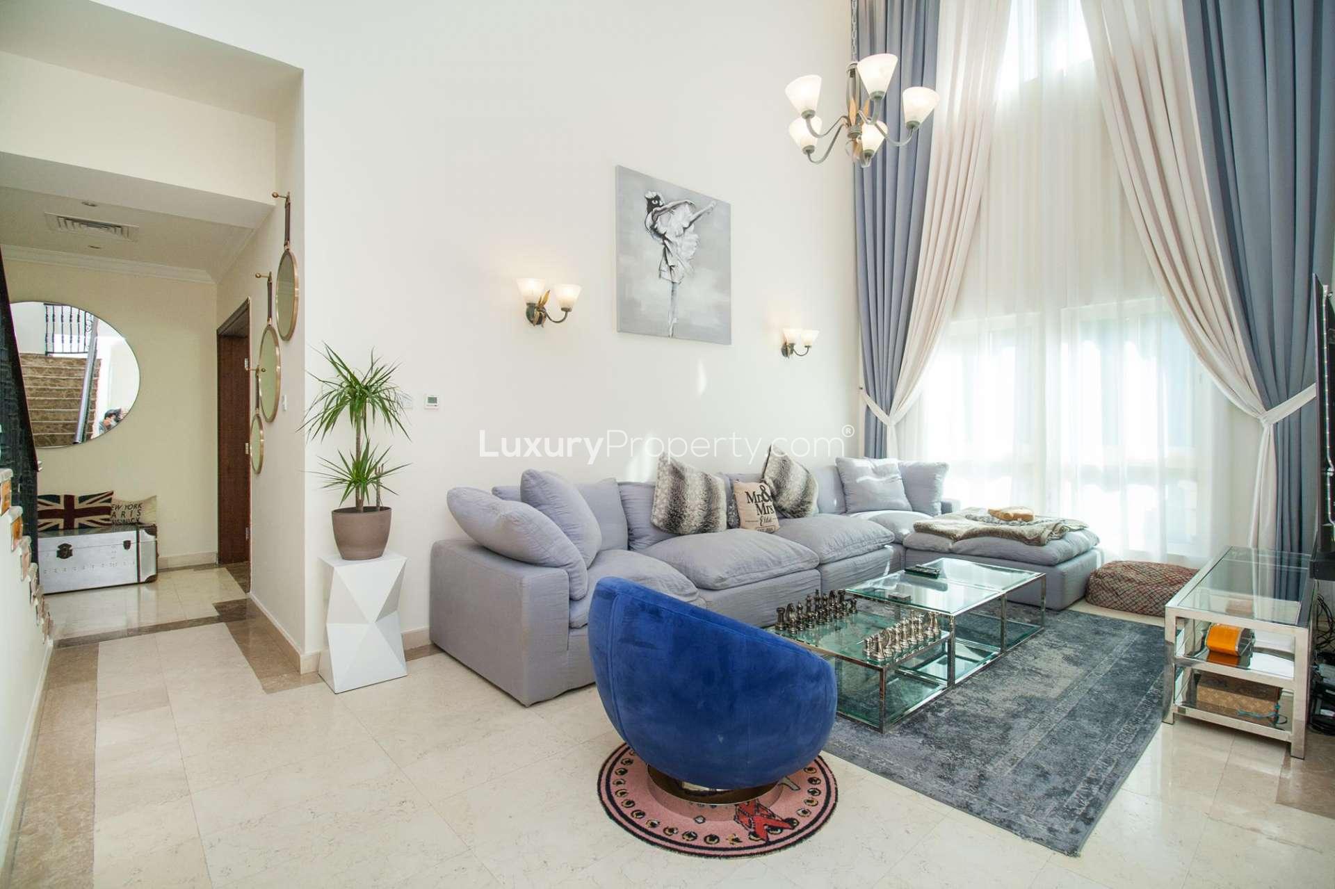 Luxurious living room with foosball table in Jumeirah Islands villa, Mediterranean Clusters