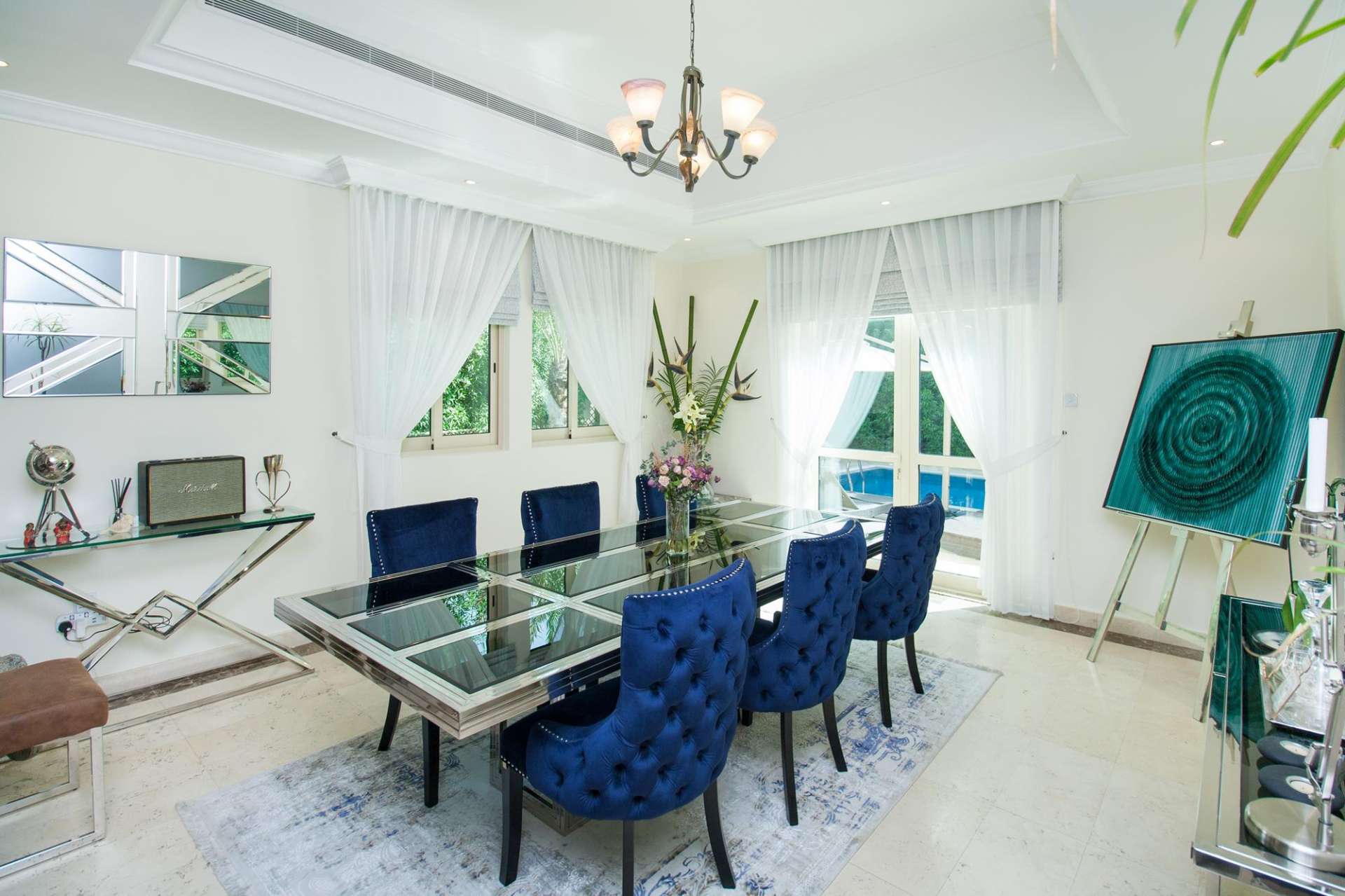 Elegant living room in 4-bedroom villa, Jumeirah Islands, featuring plush seating and decor