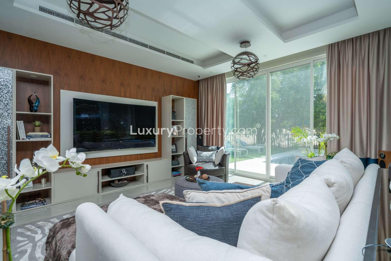 Luxurious dining room in fully renovated Jumeirah Islands villa with modern decor and glass table