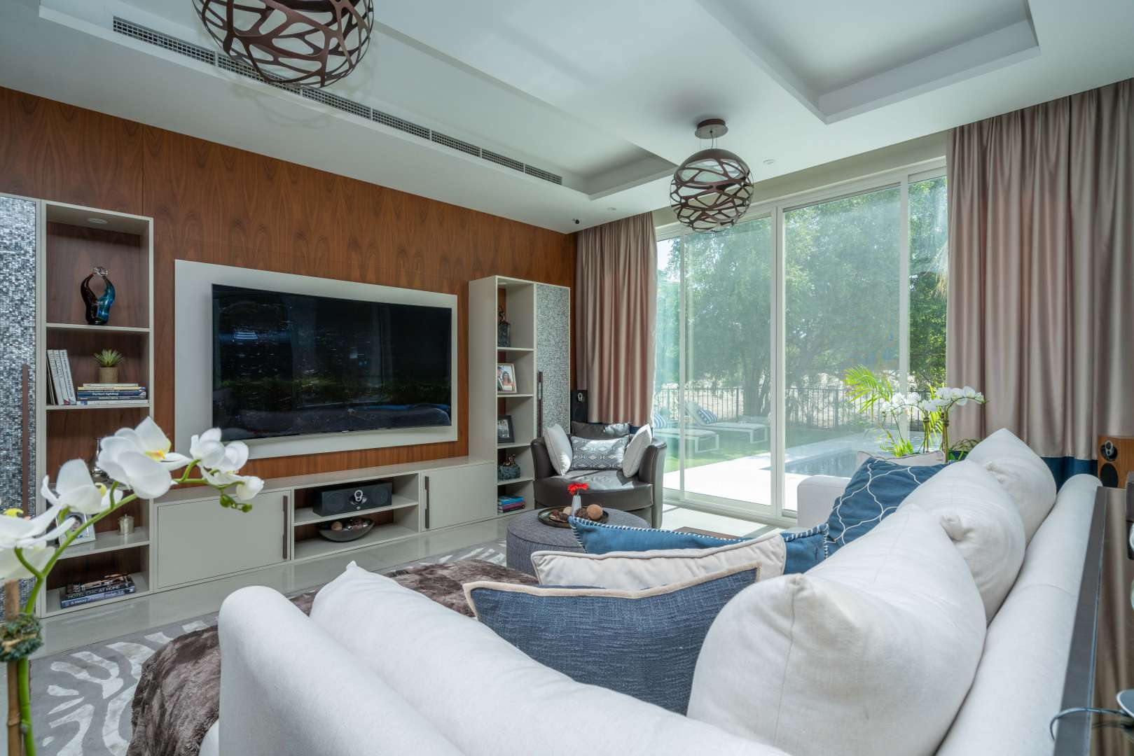 Luxurious dining room in fully renovated Jumeirah Islands villa with modern decor and glass table