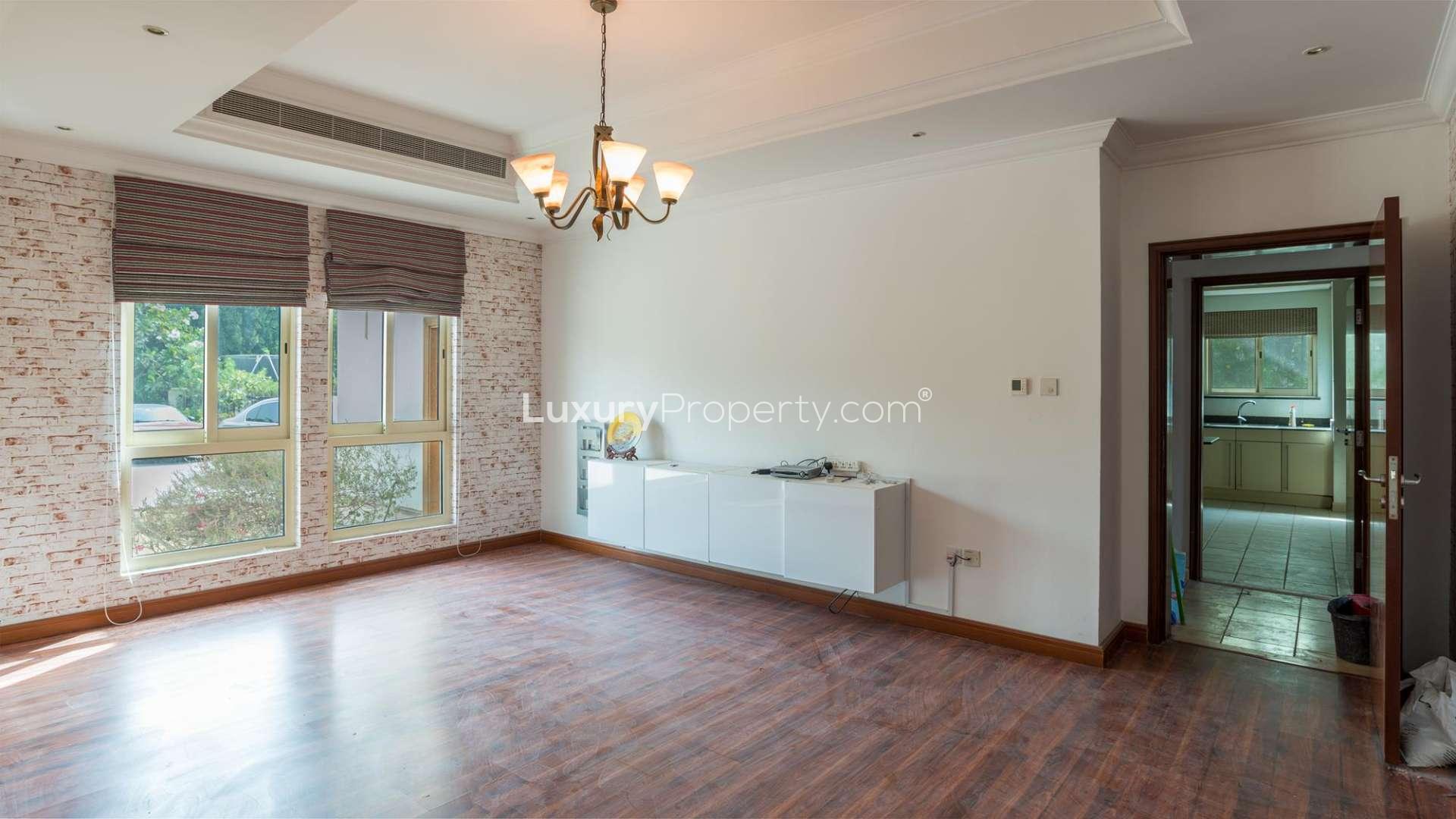 Modern kitchen in Mamluki-style Jumeirah Islands villa, featuring sleek countertops and ample cabinetry