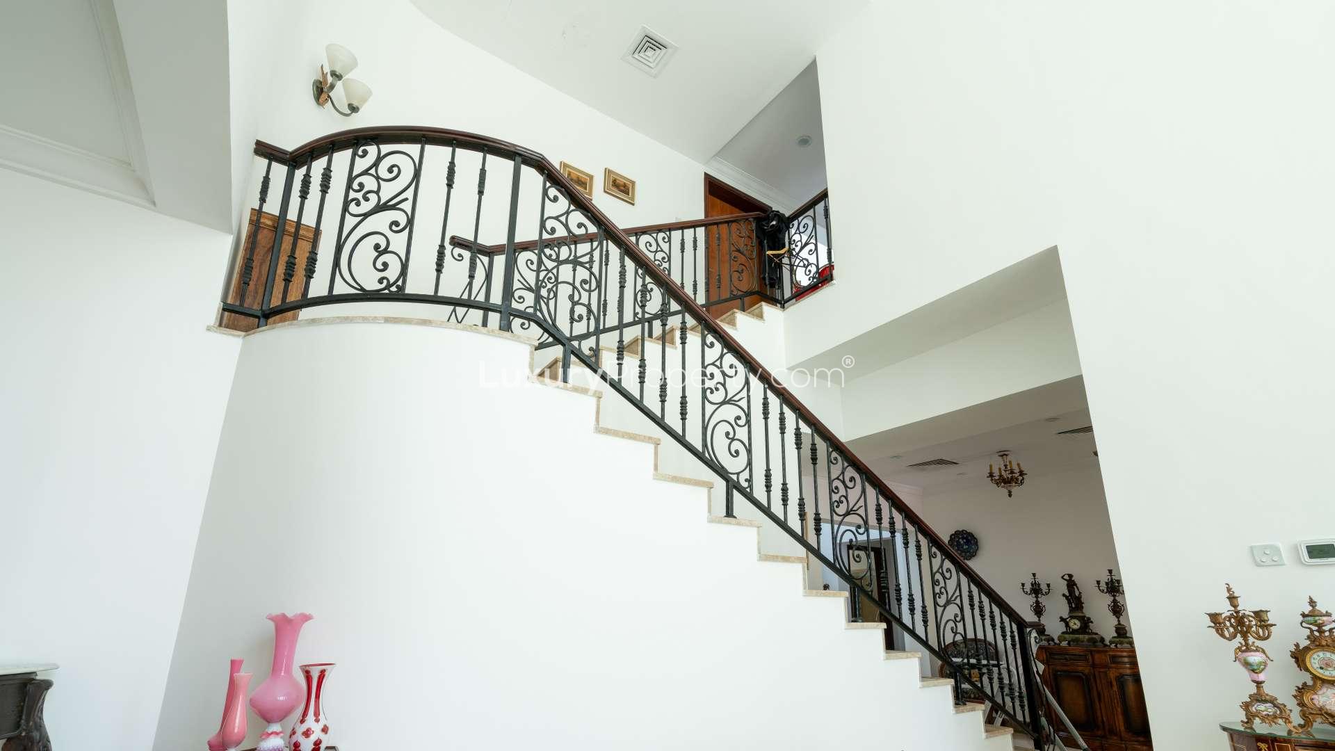 Elegant living room in Mamluki-inspired villa, Jumeirah Islands, with modern decor and natural light
