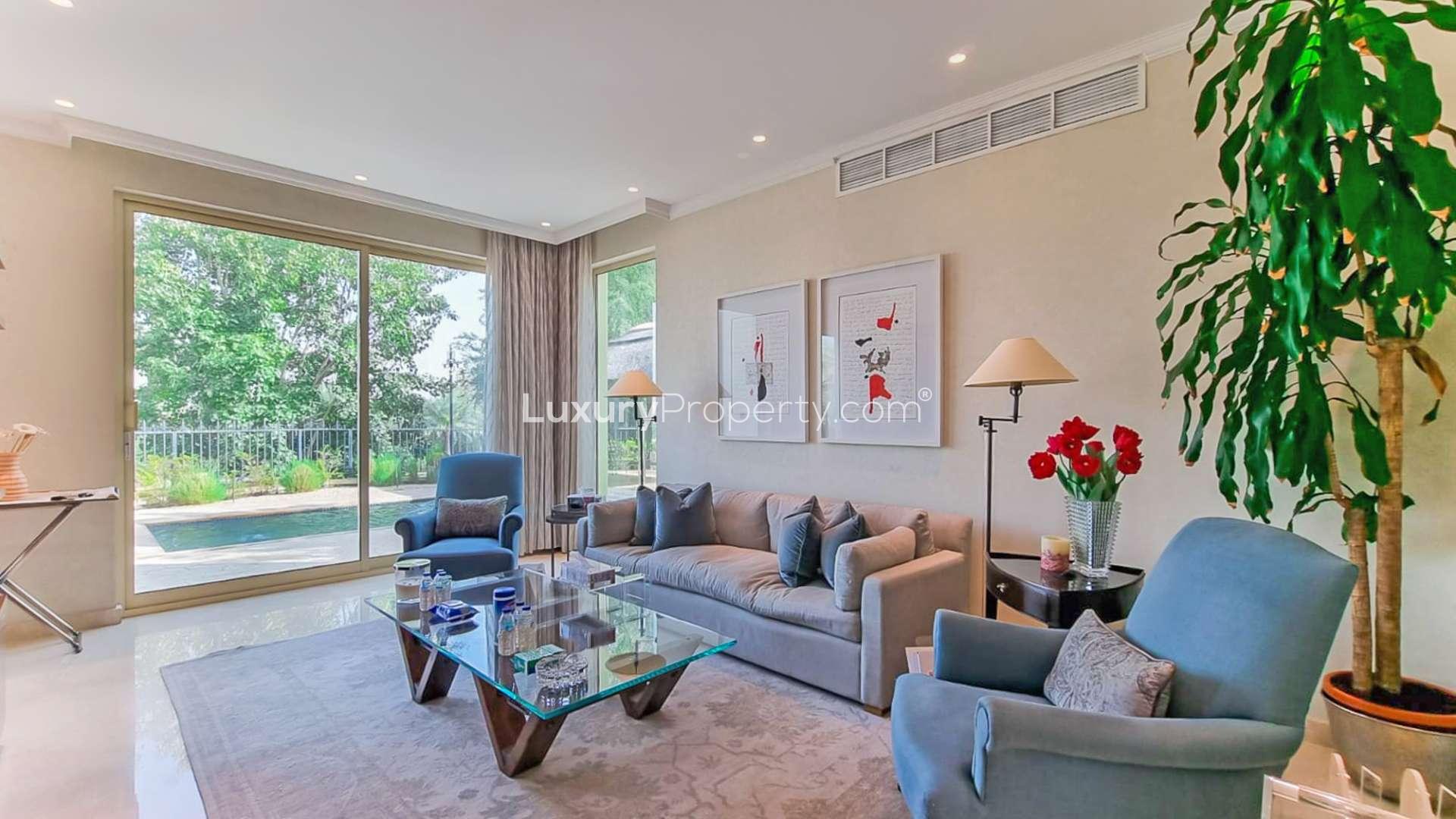 Front view of fully upgraded villa in Jumeirah Islands, European Clusters, surrounded by greenery