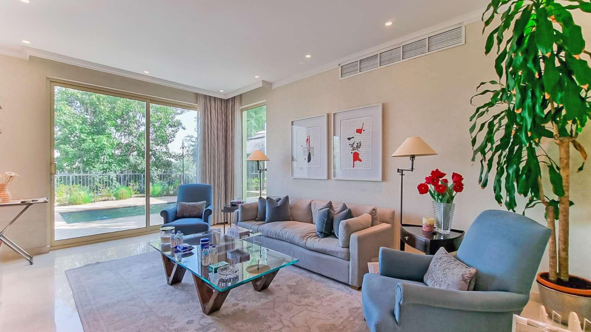 Front view of fully upgraded villa in Jumeirah Islands, European Clusters, surrounded by greenery