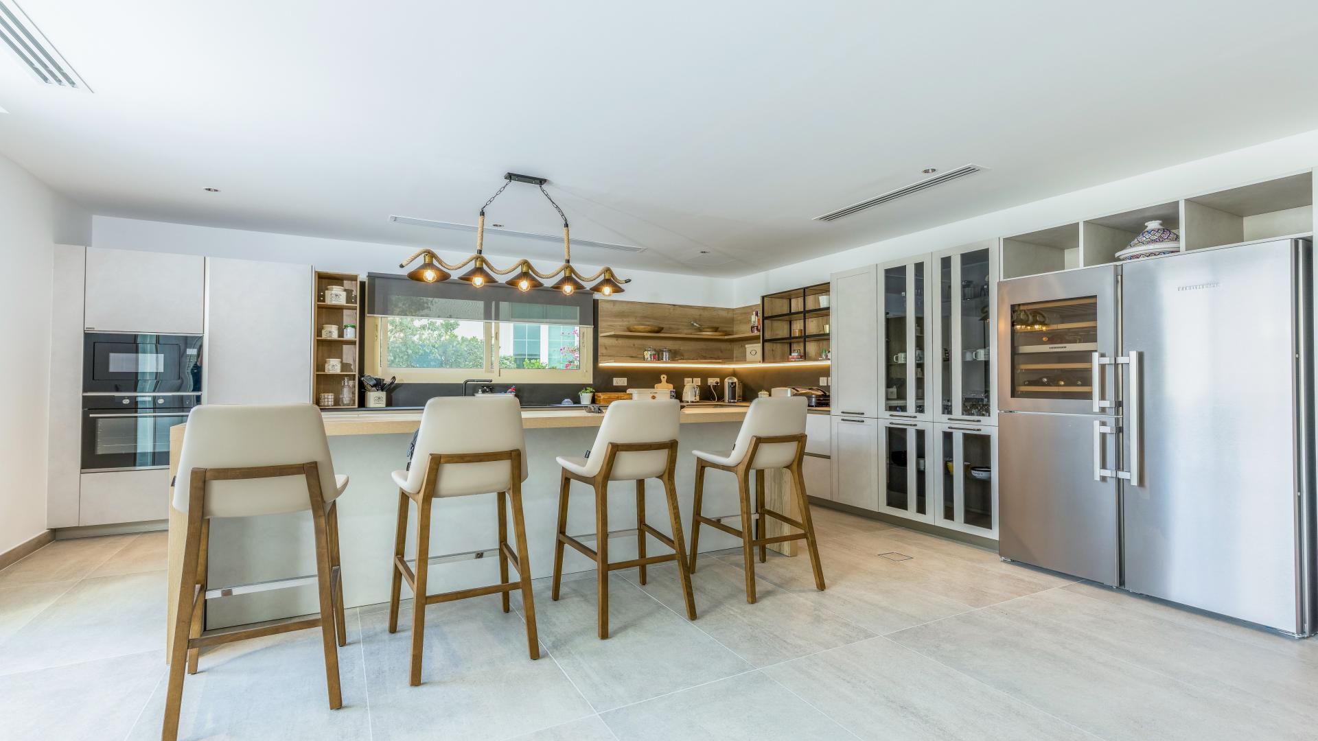 Spacious living area in fully upgraded Jumeirah Islands villa with modern decor and plants