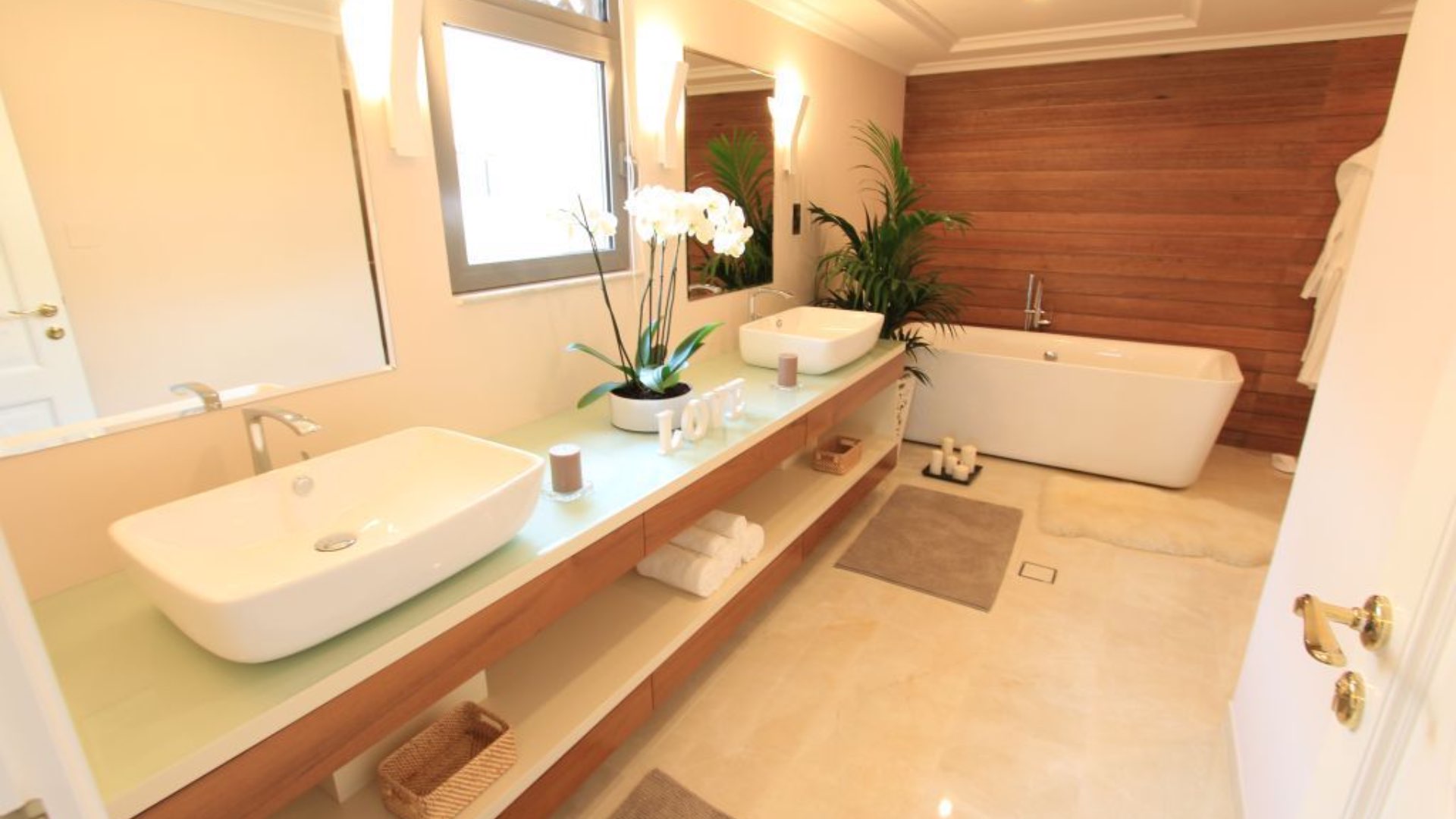 Empty room with wooden flooring, open door to bathroom, Palm Jumeirah villa for sale