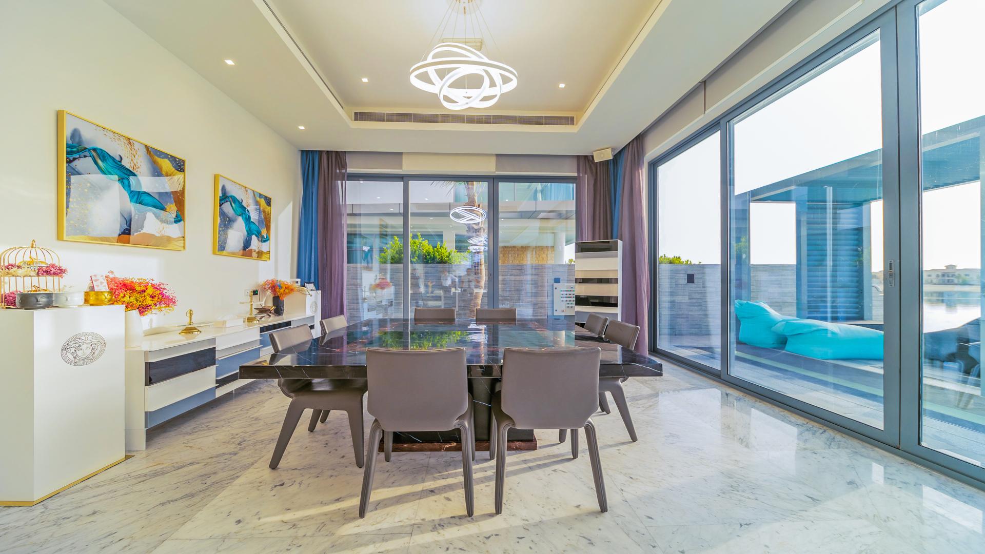 Luxurious living room in Palm Jumeirah villa, featuring modern decor and elegant furnishings