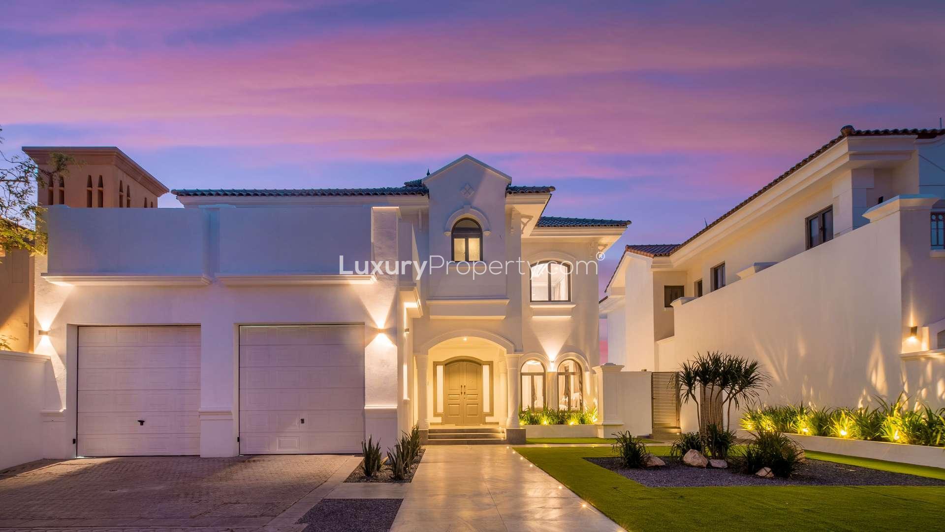 Exterior view of luxurious 4-bedroom villa with landscaped garden on Palm Jumeirah, Frond L