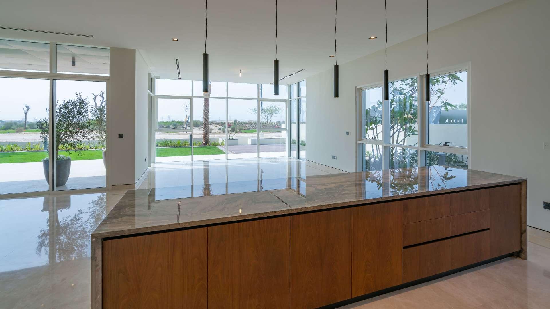 Elegant open-plan kitchen and living area in Dubai Hills Estate Golf Place villa