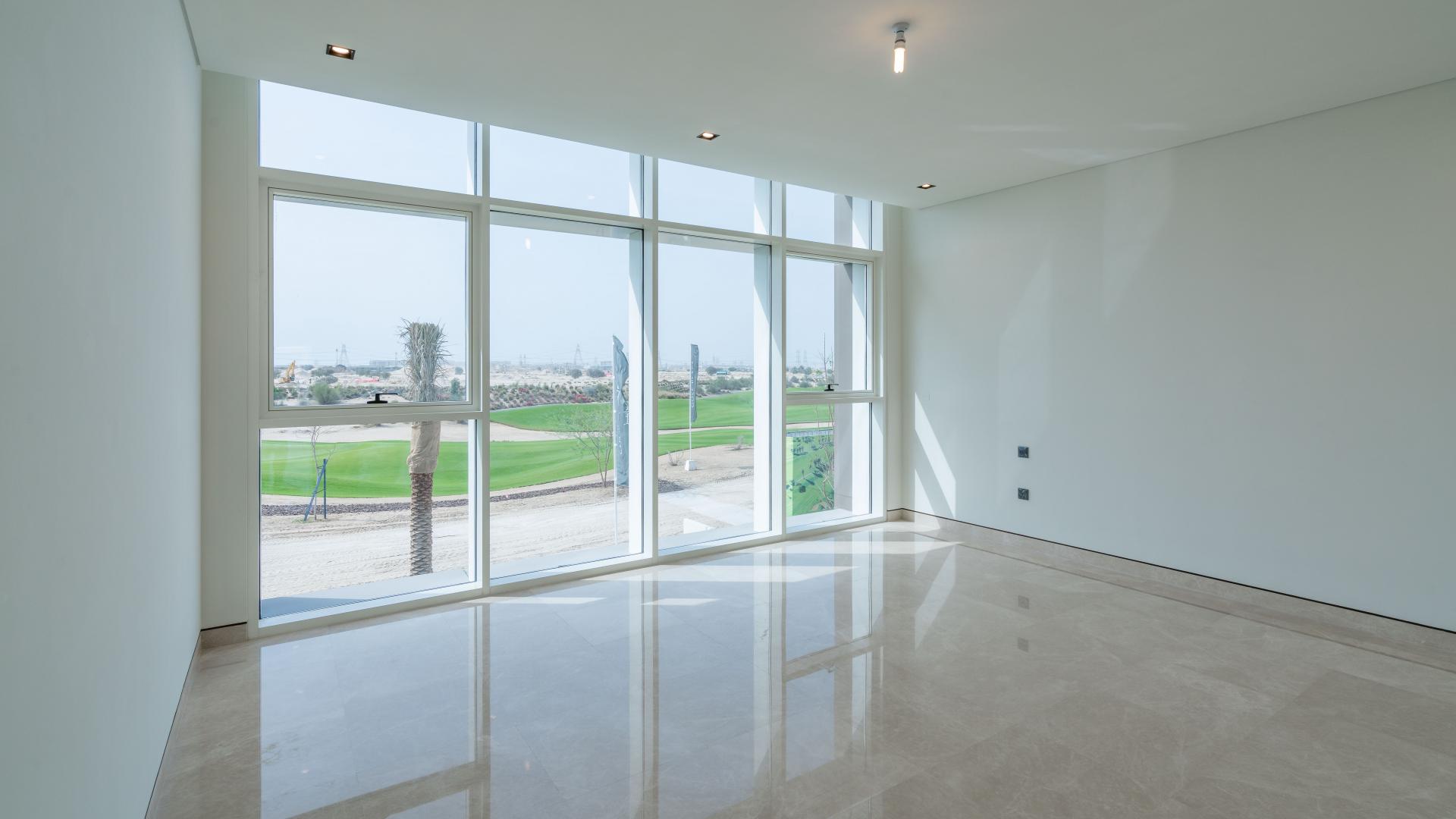 Bright room with large windows overlooking golf course in Dubai Hills Estate villa