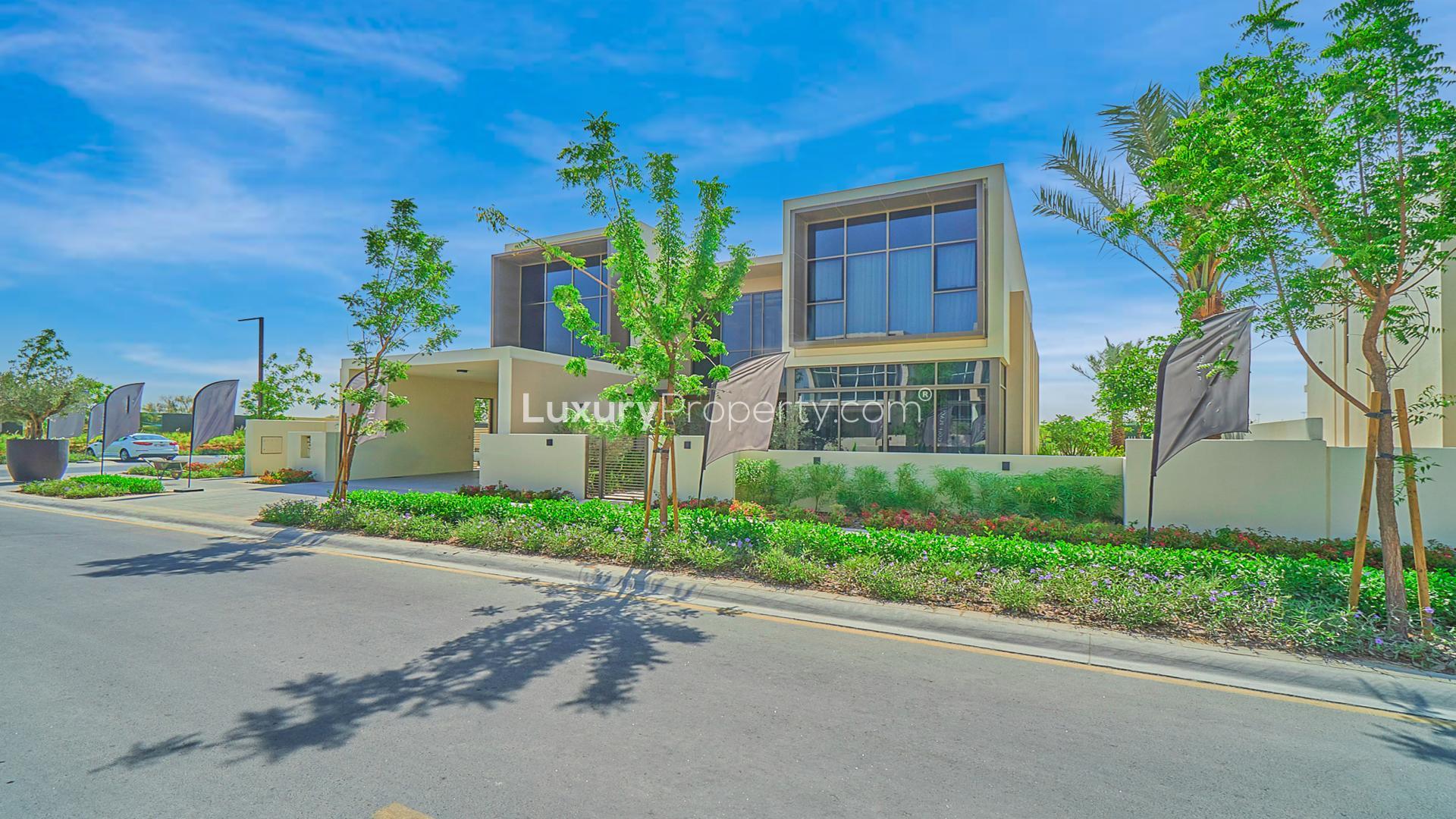 Modern living room in Dubai Hills Estate villa with elegant decor and spacious seating area