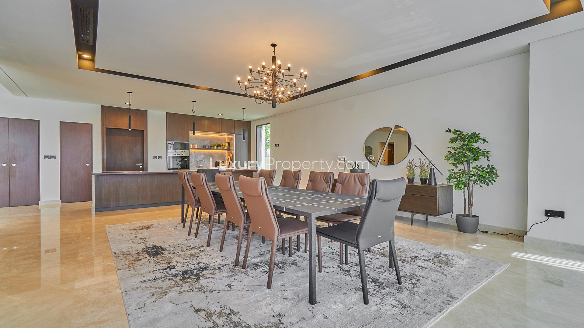 Modern living room in Dubai Hills Estate villa with elegant decor and ample natural light