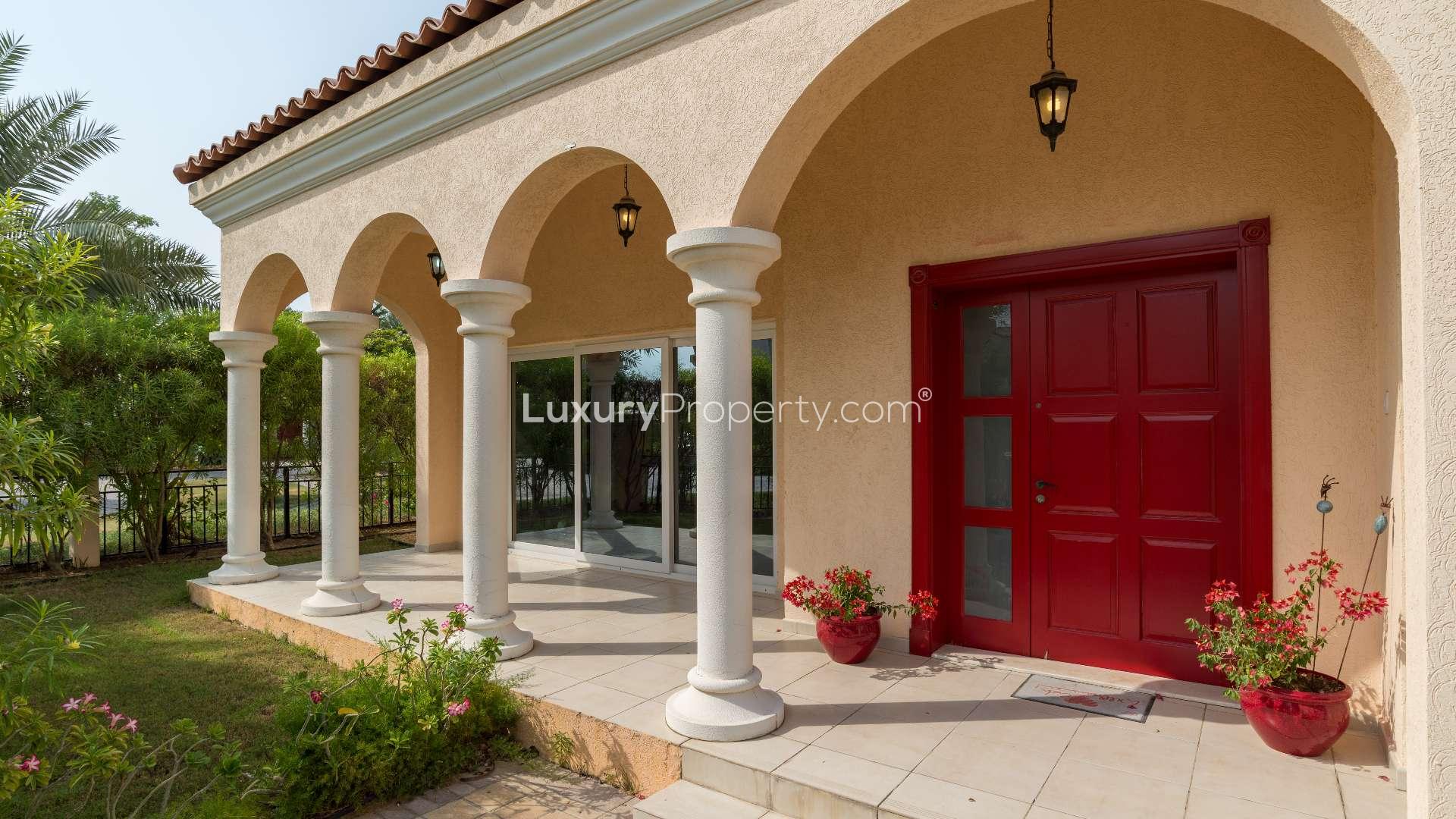 Entrance of 4-bedroom bungalow in Green Community West, featuring red door and bright interior