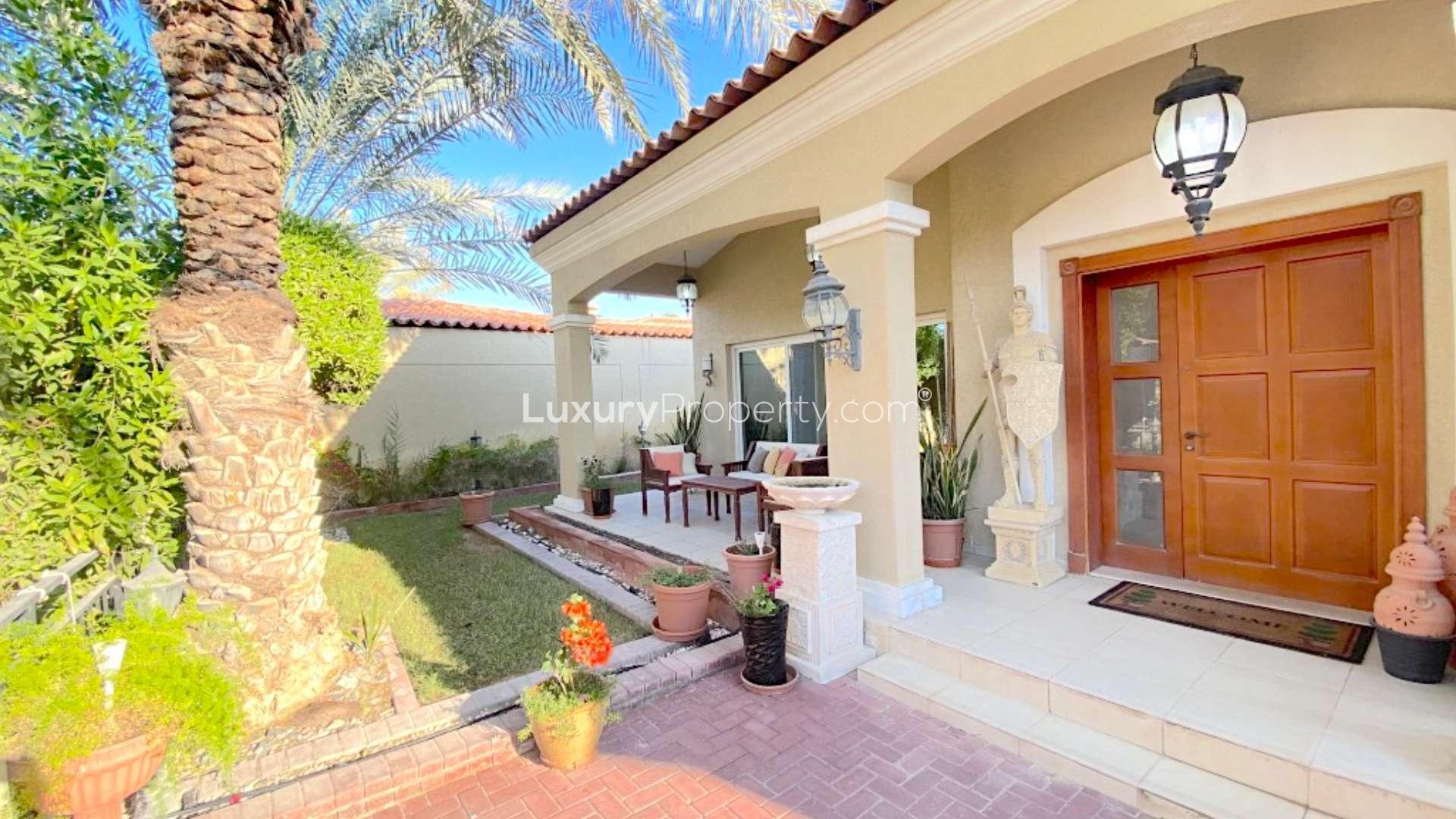 Elegant villa with private pool surrounded by lush greenery in Green Community West