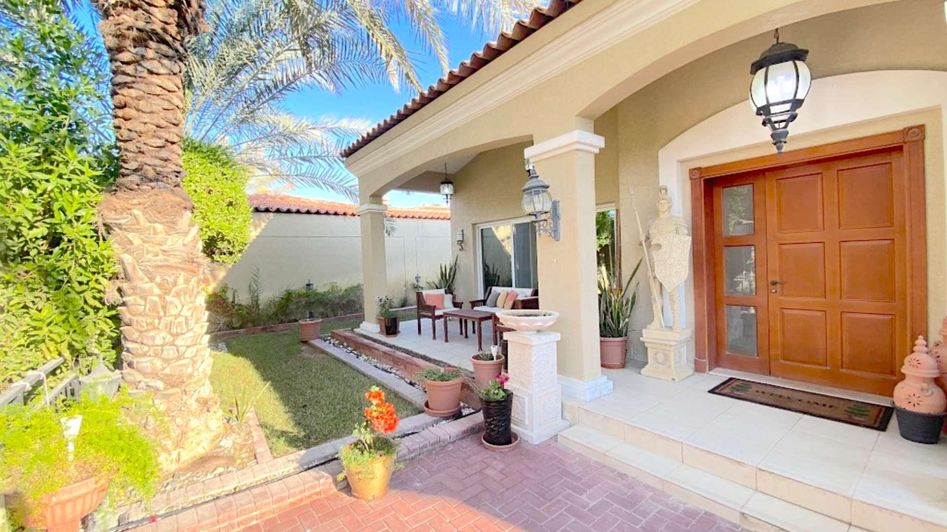 Elegant villa with private pool surrounded by lush greenery in Green Community West