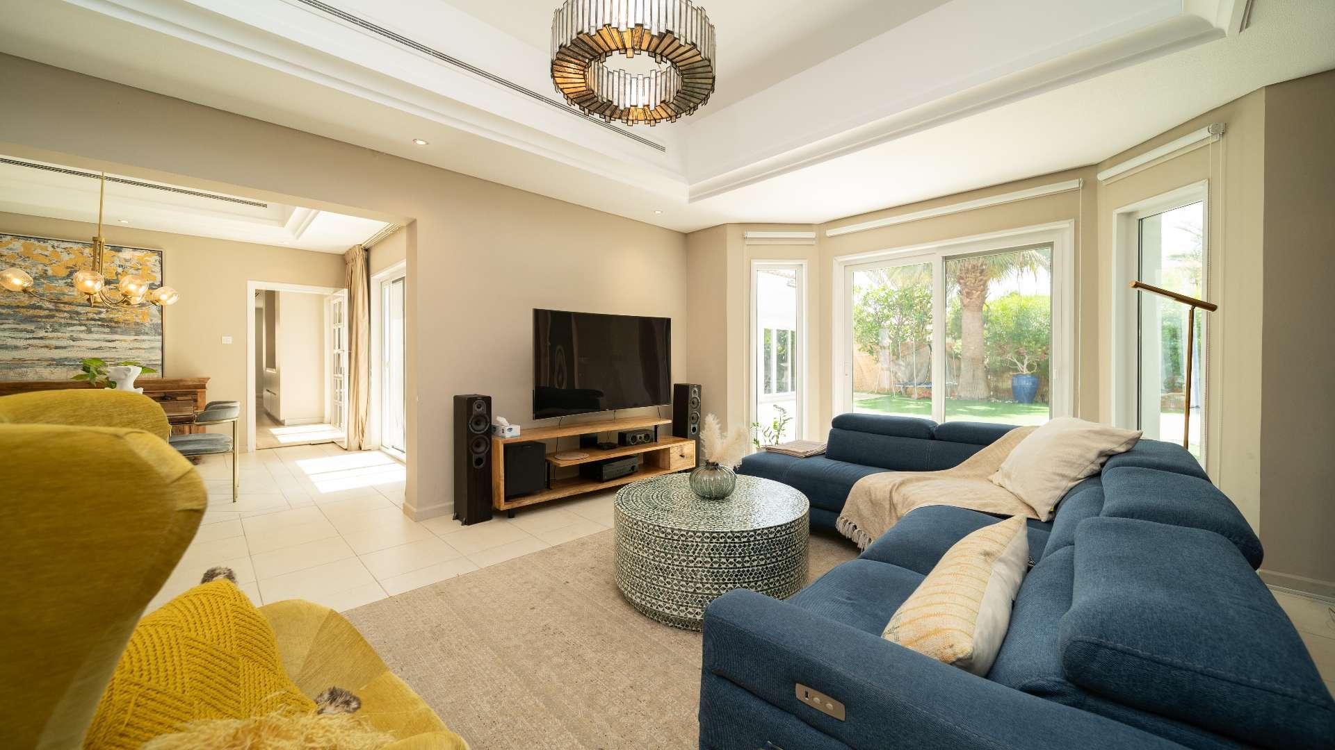 "Spacious patio of 4-bedroom bungalow in Green Community West, featuring outdoor seating area.",Living room of 4-bedroom bungalow in Green Community West with modern decor and natural light