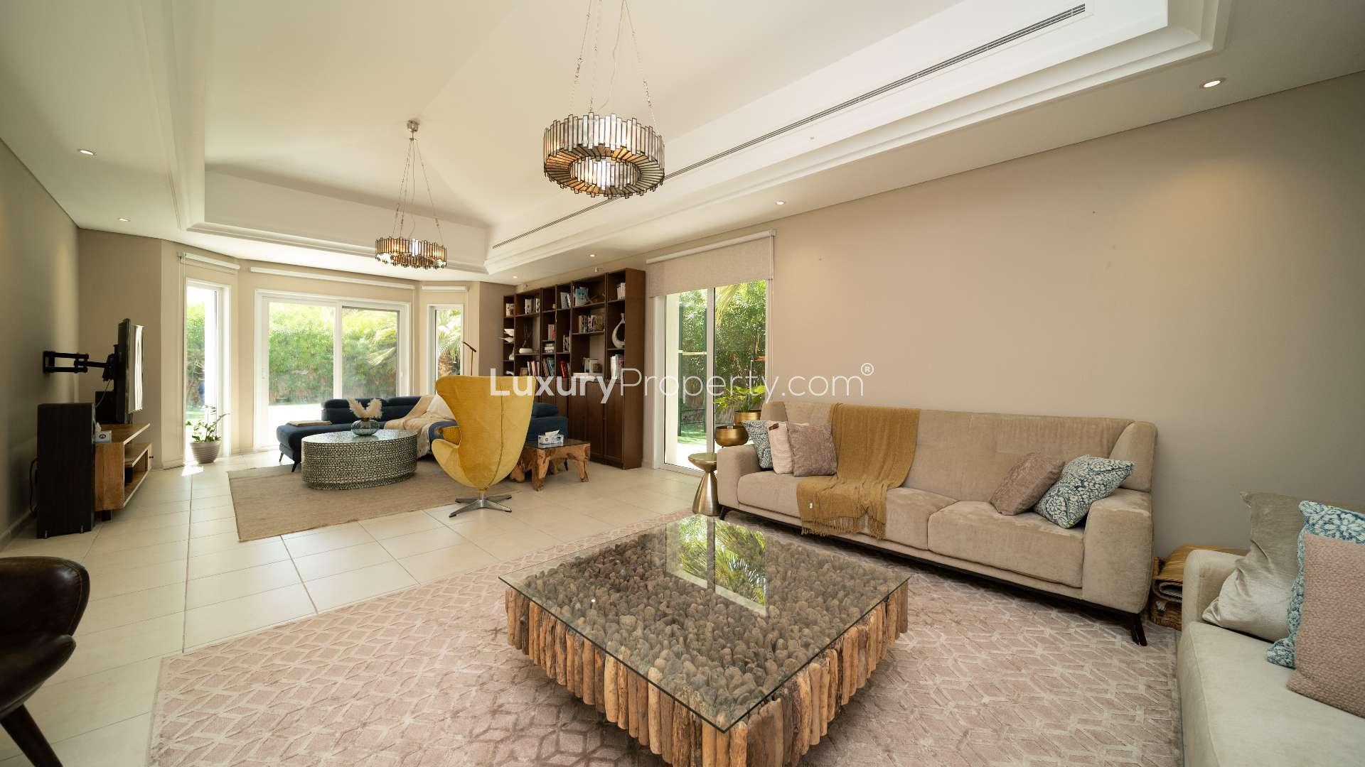 Beautiful 4-bedroom villa exterior with lush garden in Green Community West for sale