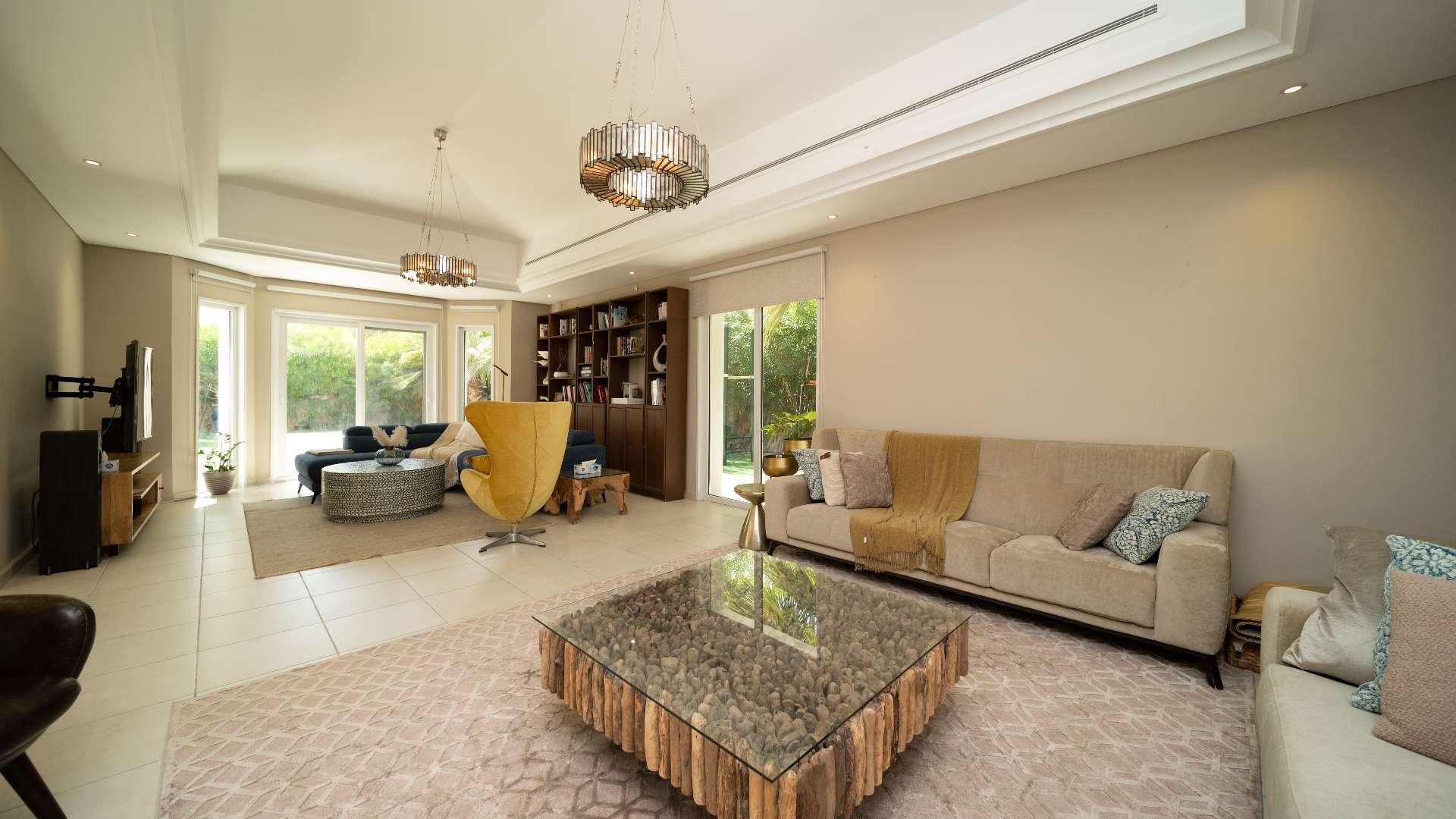 Beautiful 4-bedroom villa exterior with lush garden in Green Community West for sale