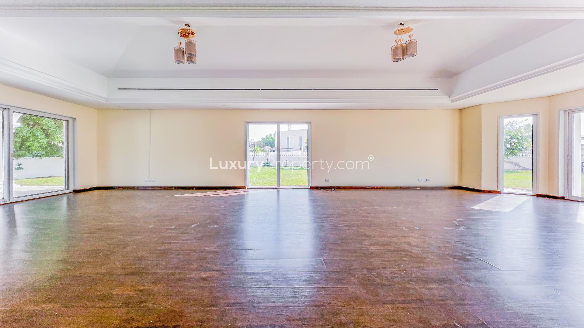 Spacious living room in 5-bedroom villa, Green Community West, with garden views