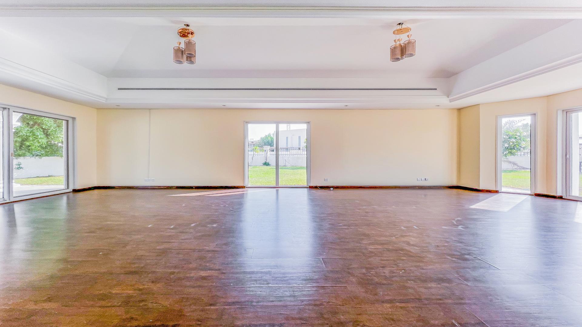 Spacious living room in 5-bedroom villa, Green Community West, with garden views